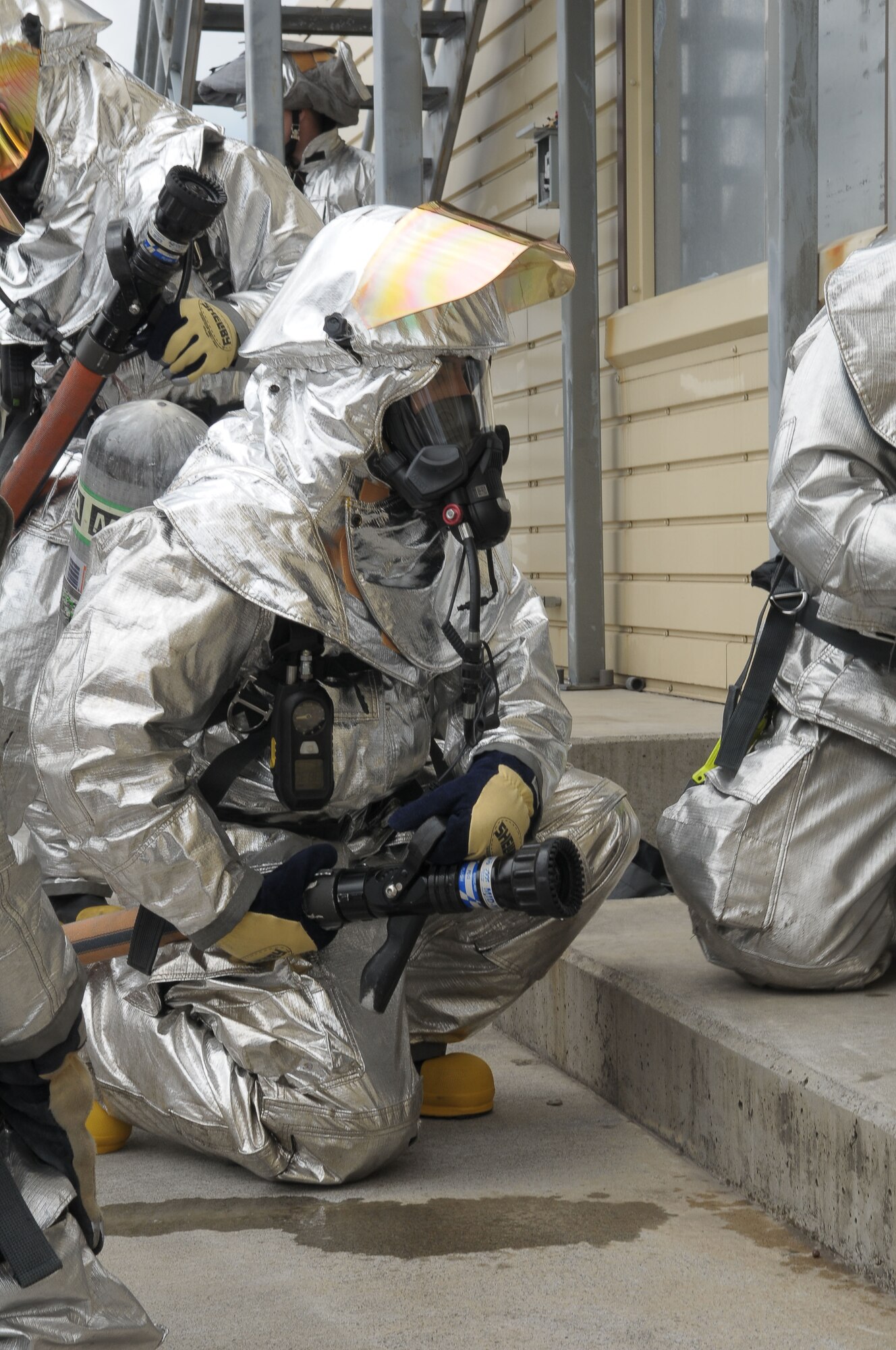 YOKOTA AIR BASE, Japan -- Chief Master Sgt. Benjamin Caro, 374th Airlift Wing command chief, prepares to enter a burning building April 20 during a live fire training exercise. This was the first time that wing leadership had participated in this type of exercise. (U.S. Air Force photo/Airman 1st Class Sean Martin)