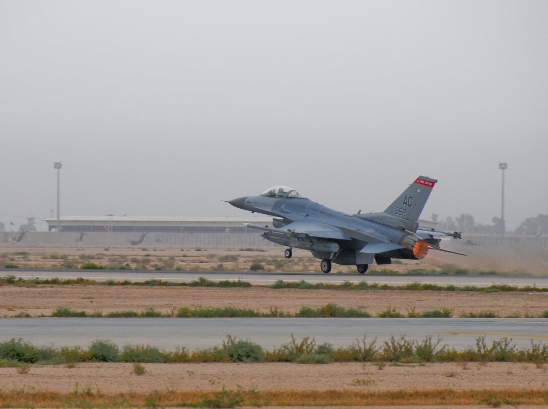 An F16C+ from the 177th Fighter Wing lifts off from the runway of an undisclosed airfield in Southwest Asia on April 7, 2010. 177th unit members, aircraft and support equipment from the Egg Harbor Township, NJ Air National Guard base deployed in support of Operation Iraqi Freedom. U.S. Air Force photo/Master Sgt. Andrew Moseley