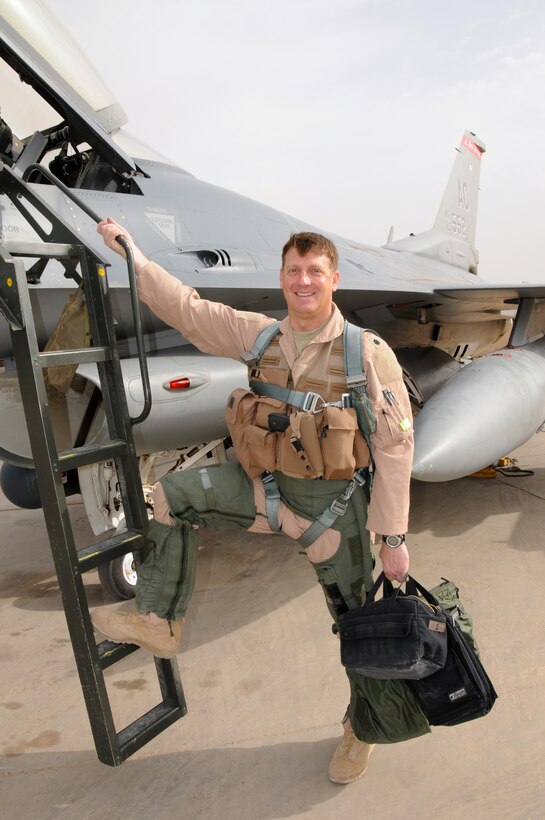 Lt. Col. Brad "Francis" Everman, 332nd Expeditionary Fighter Squadron Commander, steps to his F16C+ Fighting Falcon prior to departing on a Combat Air Patrol over an undisclosed location in Southwest Asia on April 7, 2010. Colonel Everman is also a Flight Commander at the 177th Fighter Wing, New Jersey Air National Guard, located in Egg Harbor Township, NJ. U.S. Air Force photo/Master Sgt. Andrew J. Moseley