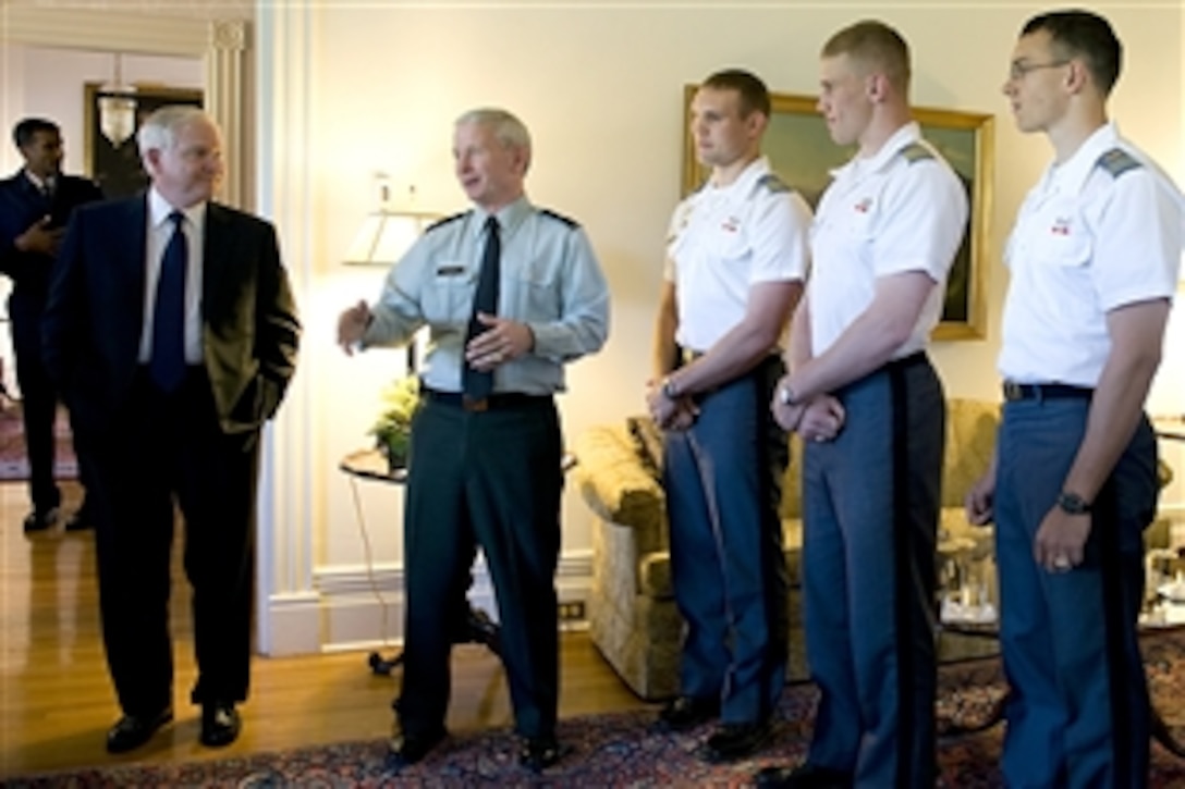 Defense Secretary Robert M. Gates speaks with West Point Military Academy Dean Army Brig. Gen. Patrick Finnegan and cadets at the United States Military Academy at West Point, N. Y., April 22, 2010.