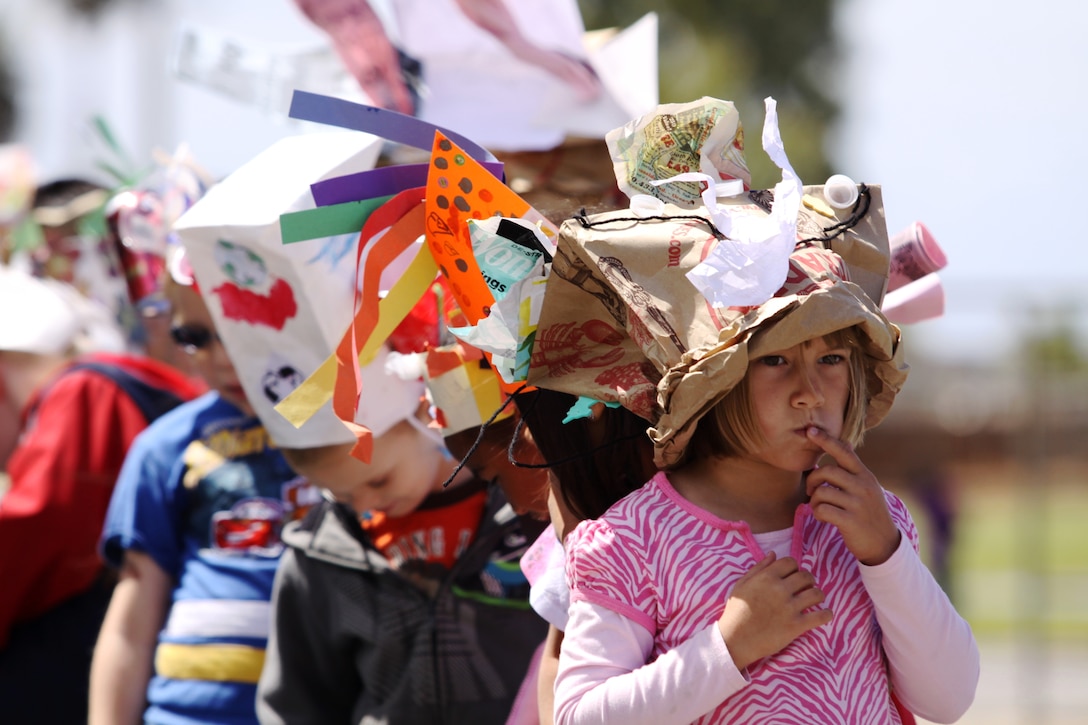 Torrey Stapps, a kindergarten student from North Terrace Elementary School, Oceanside Calif., awaits the start of the school’s first Earth Day Recycled Hat Parade, April 22. Hundreds of students, primarily from the Camp Pendleton community, made extravagant hats from items commonly thrown in the trash. Teachers and faculty staff judged the wacky creations and awarded the most creative designs. The school’s parade was just one of the many Earth Day events enjoyed by local service members and their families.