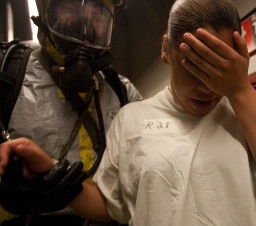 NEW YORK -- A Marine from the Chemical Biological Incident Response Force (CBIRF) follows a victim of a chemical attack out of the simulated subway trainer, at FDNY Fire Academy on Randall's Island, N.Y, April 22. FDNY and Marines from the Chemical Biological Incident Response Force (CBIRF) joined together for a training exercise after a weeklong training evolution between the two units.  (Official Marine Corps photo by Sgt. Randall A. Clinton / RELEASED)