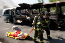 NEW YORK -- A FDNY firefighter races to help victims during a simulated bus bombing, at FDNY Fire Academy on Randall's Island, N.Y, April 22. FDNY and Marines from the Chemical Biological Incident Response Force (CBIRF) joined together for a training exercise after a weeklong training evolution between the two units.  (Official Marine Corps photo by Sgt. Randall A. Clinton / RELEASED)