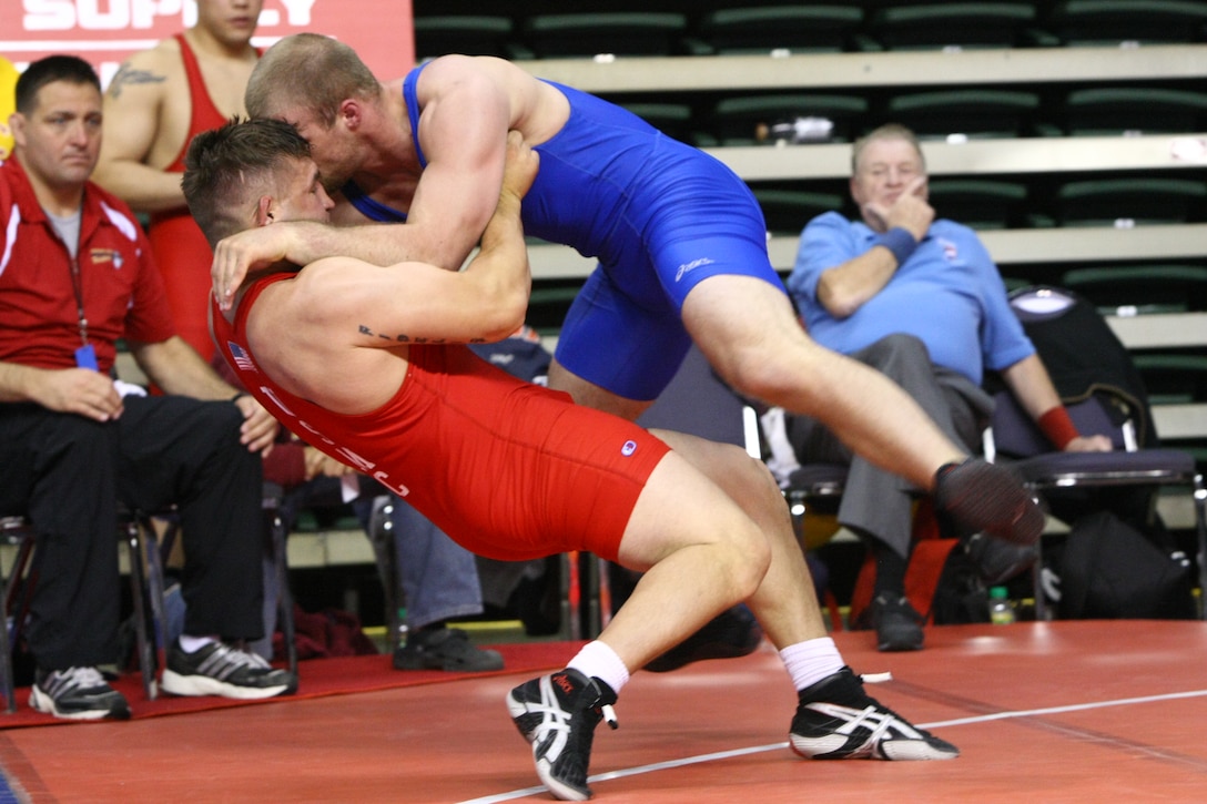 Cpl. Courtney Myers, All-Marine Wrestling Team member, uses an opponent’s weight to his advantage and throws him out of bounds during his last wrestling match at the U.S. Senior National Wrestling Championships, Cleveland State University, Cleveland, Ohio, April 24.