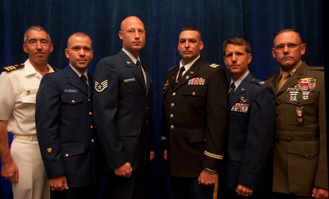 100423-M-9161A-006 CAMP H. M. SMITH, Hawaii - Officials with the Aloha Council invited service members to the Boy Scouts of America's 57th Annual Eagle Scout Recognition Banquet April 23 at the Hawaii Prince Hotel - Waikiki, Hawaii. (From left to right) Navy Cmdr. Michael Ballou, Coast Guard Petty Officer 3rd Class Ronald J. Williams, Air Force Staff Sgt. Jeremiah Turpin, Army Maj. John Crews, Hawaii Air National Guard Col. Michael B. Compton and Col. Walter R. Watson earned the title of Eagle Scout as teenagers. The Aloha Council invited them to inspire the younger Eagle Scouts to continue community service throughout their lives. (U.S. Marine Corps photo by Sgt. Juan D. Alfonso)(Released)