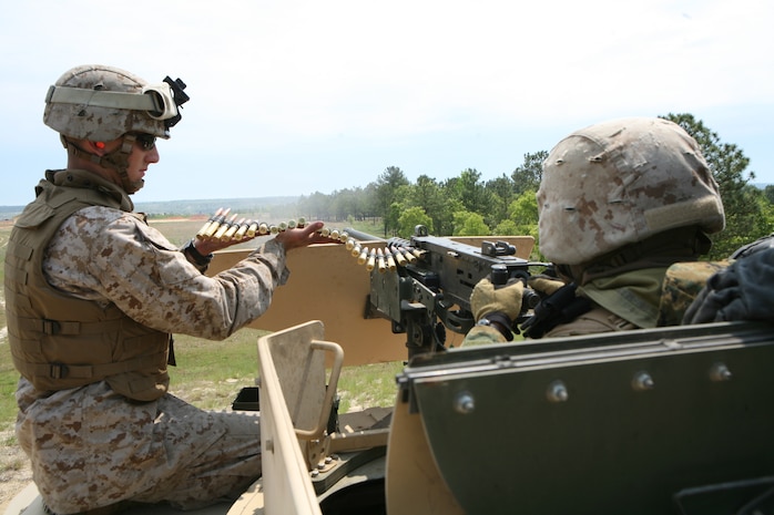 Marines with Combat Logistics Battalion 2, 2nd Marine Logistics Group, test fire a M2 .50 caliber machine gun at the Convoy Live Fire Ambush Range aboard Fort Bragg, N.C., April 23, 2010, as part of the battalion’s field exercise.  The battalion conducted the exercise to simulate combat logistics convoy operations, general engineering, and command and control operations in preparation for their future deployment to Afghanistan. (U.S. Marine Corps photo by Gunnery Sgt. Katesha Washington)