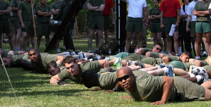 Marines with Combat Logistics Battalion 22, Combat Logistics Regiment 27, 2nd Marine Logistics Group, lay in the resting position while waiting for the sound of the whistle to begin the tug-of-war competition during the CLR-27 field meet aboard Camp Lejeune, N.C., April 24, 2010.  Marines and sailors with CLR-27 participated in events including sumo wrestling, relay races and a biathlon.  Along with breeding competition, the events built camaraderie between fellow Marines and sailors.