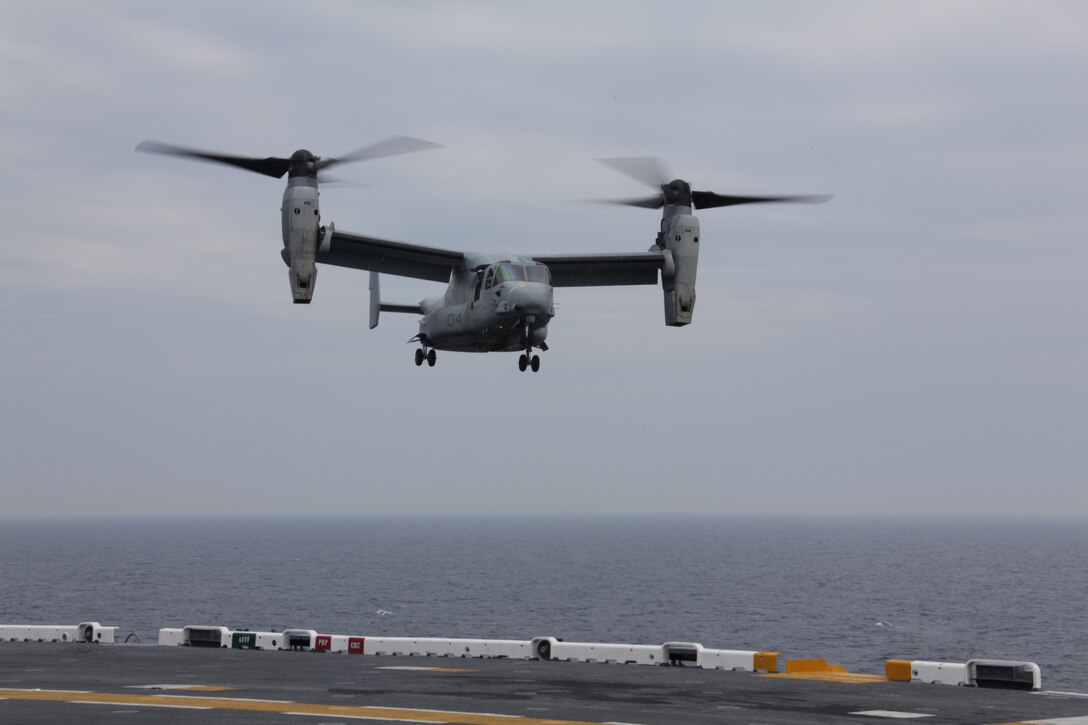 An MV-22 Osprey with Marine Medium Tiltrotor Squadron 266, 26th Marine Expeditionary Unit, makes its descent onto the flight deck of USS Kearsarge, April 23, 2010. 26th MEU is embarked aboard USS Kearsarge, USS Carter Hall, and USS New York for Amphibious Squadron (PHIBRON)/ Marine Expeditionary Unit Integration (PMINT) training. PMINT integrates 26th MEU Marines with their Navy counterparts to train in planning and execution of missions they could conduct when they deploy together this fall.