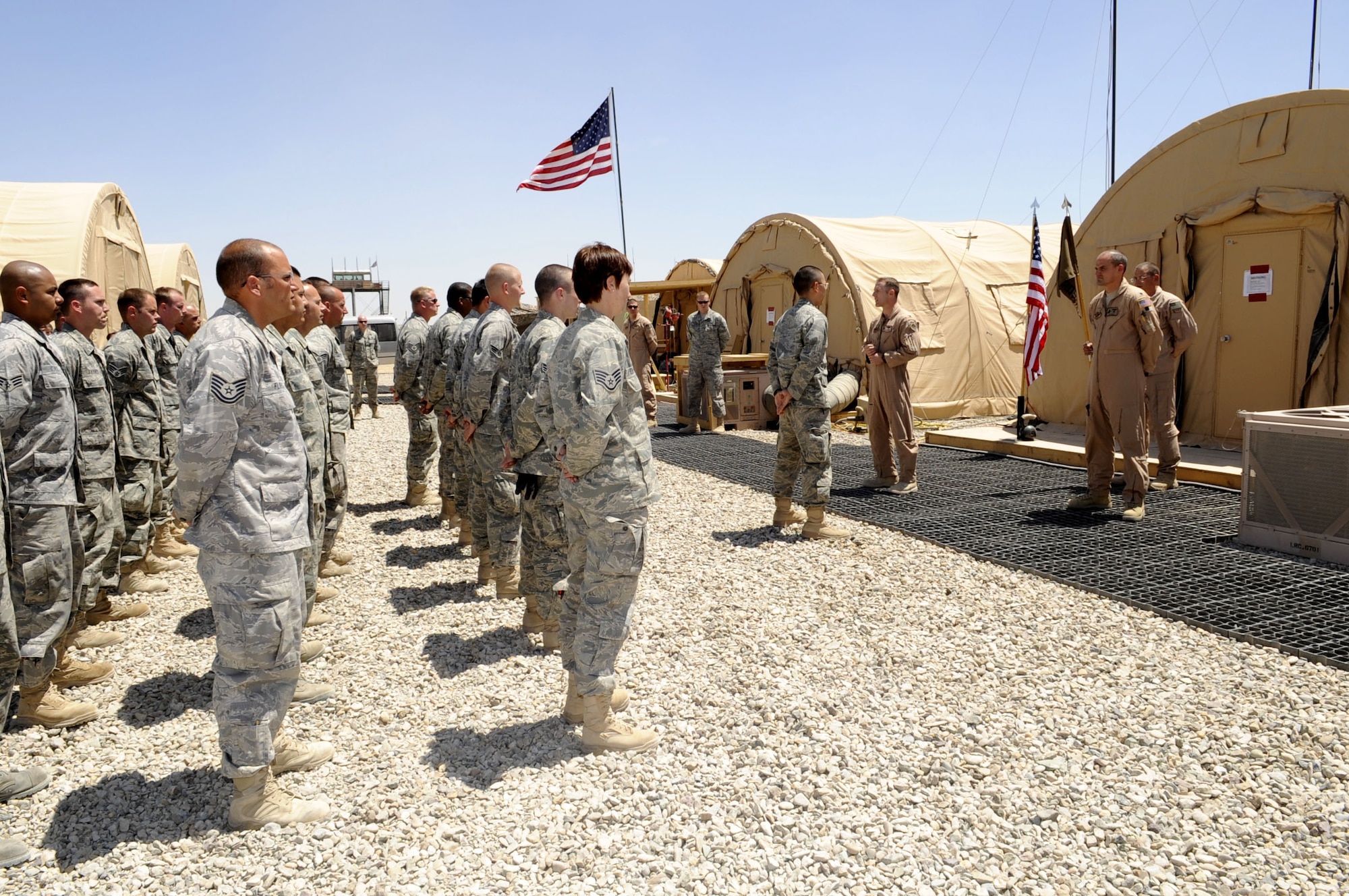 Members of the 79th Expeditionary Rescue Squadron stand at parade rest while Col. John Cherrey, 451st Expeditionary Operations Group commander, shares his thoughts on the activation of the 79th Expeditionary Rescue Squadron April 22 at Camp Bastion, Afghanistan.  There are currently more than 80 members and two HC130 attached to the 79th ERQS.  (U.S. Air Force photo by Senior Airman Nancy Hooks/Released)