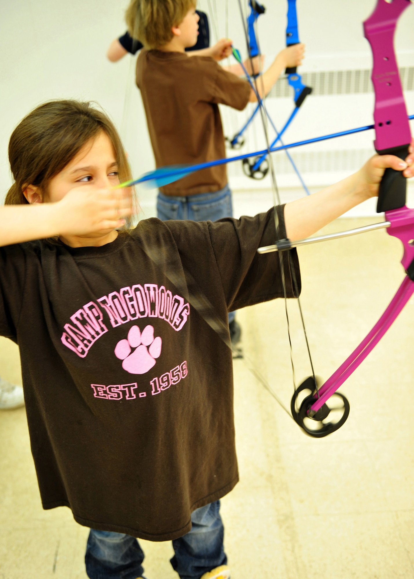 ELMENDORF AIR FORCE BASE, Alaska -- Felcity Soto shoots at a target in an archery training class sponsored by the Black Sheep Bowmen Archery Club 17 April. Black Sheep Bowmen Archery Club held an indoor archery class introduce youth to the sport of archery. The next class onbase will be in the fall. (Air Force photo by Master Sgt. Brian Smith)