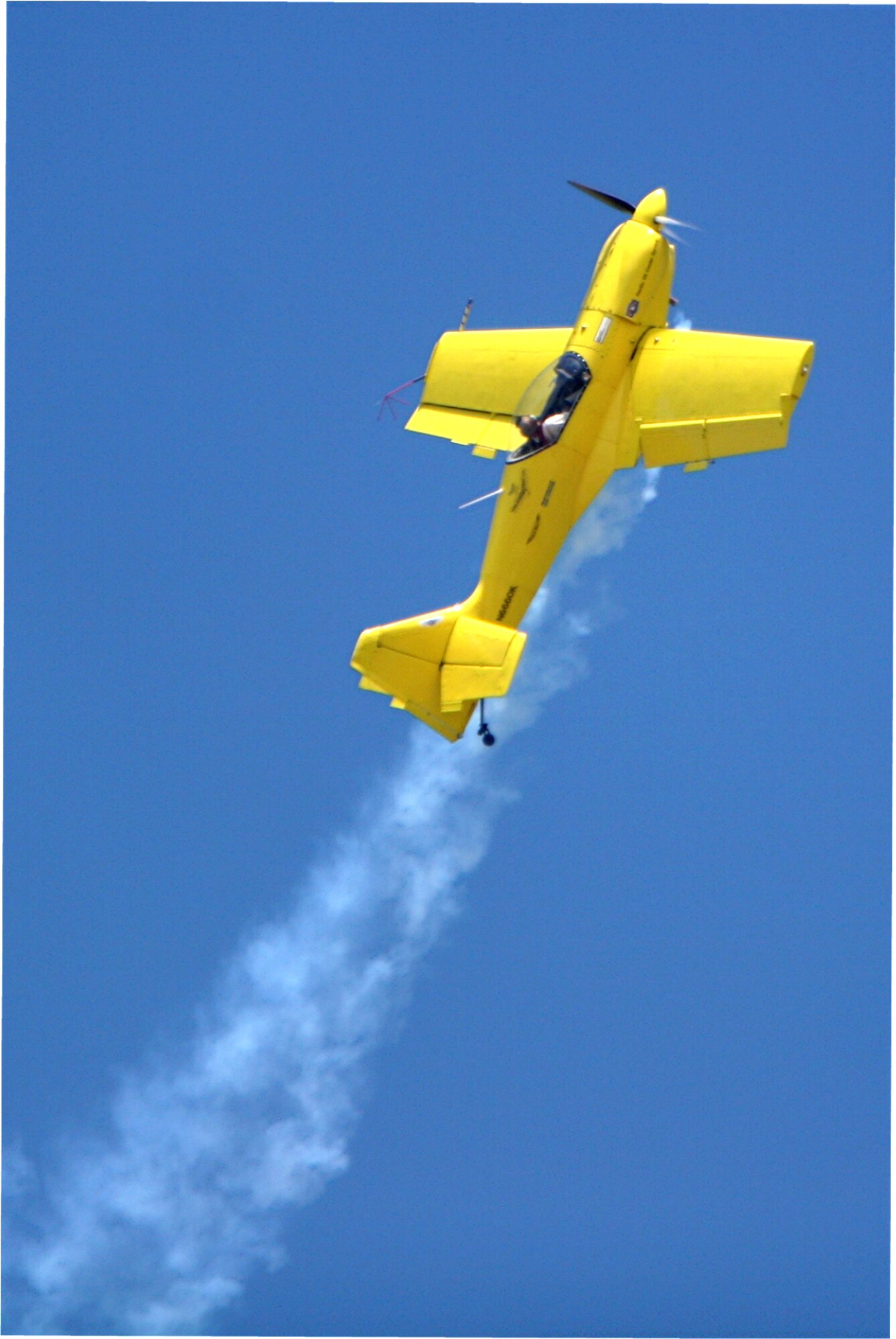 Rob Harrison pops in and out of puffs of white smoke, spinning, diving and twisting through the air in a specially built monoplane and repeatedly contorting his body to resist up to eight times his body weight in pressure. You can see and meet The Tumbling Bear at March Air Reserve Base's AirFest 2010 on May 1 and 2. (Photo courtesy of Rob Harrison) 