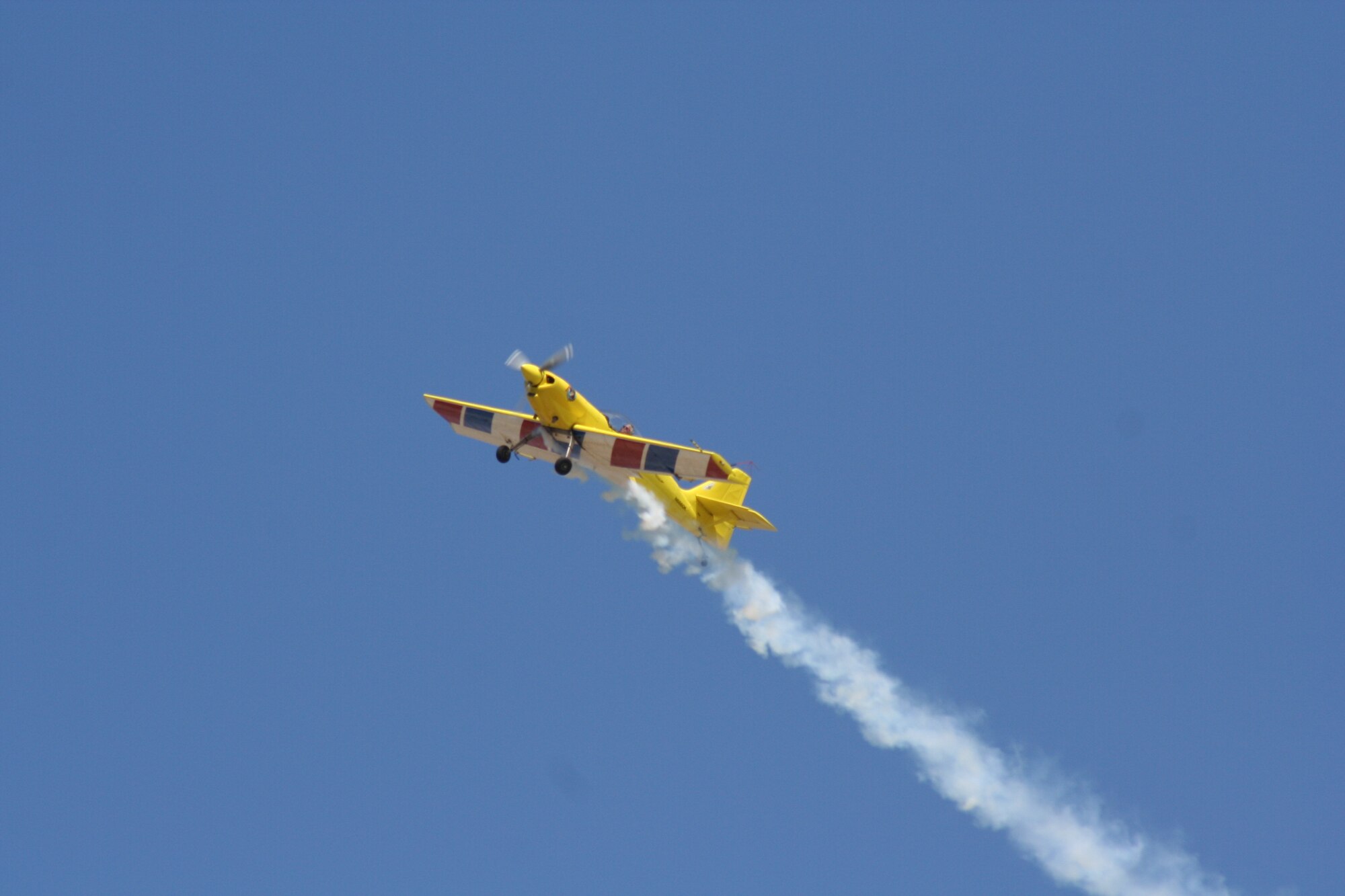 Rob Harrison pops in and out of puffs of white smoke, spinning, diving and twisting through the air in a specially built monoplane and repeatedly contorting his body to resist up to eight times his body weight in pressure. You can see and meet The Tumbling Bear at March Air Reserve Base's AirFest 2010 on May 1 and 2. (Photo courtesy of Rob Harrison) 