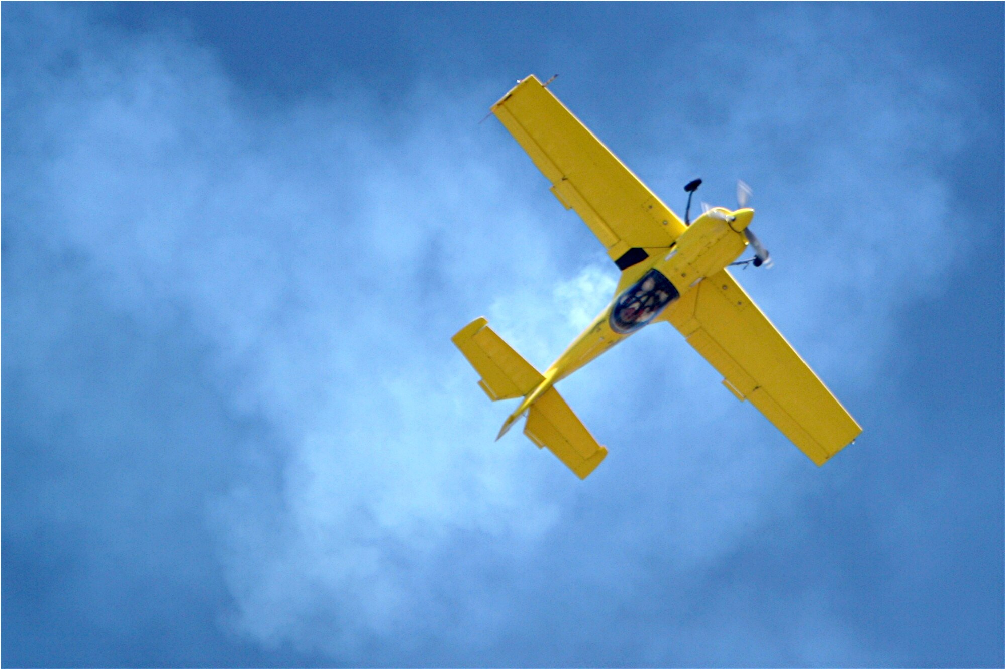 Rob Harrison pops in and out of puffs of white smoke, spinning, diving and twisting through the air in a specially built monoplane and repeatedly contorting his body to resist up to eight times his body weight in pressure. You can see and meet The Tumbling Bear at March Air Reserve Base's AirFest 2010 on May 1 and 2. (Photo courtesy of Rob Harrison) 