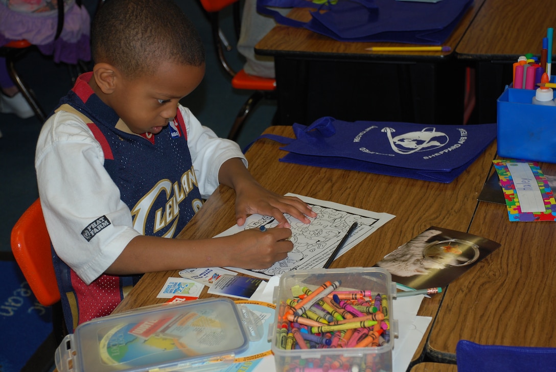 A Sheppard Elementary school second-grade class engaged in various fun activities during the class’ focus on Earth Day April 22, 2010.  Caleb Bunkley, second-grader, learned about recycling as he colored his “wild about earth” activity sheet.  (U.S. Air Force photo/Tech Sgt. Vernon Cunningham)
