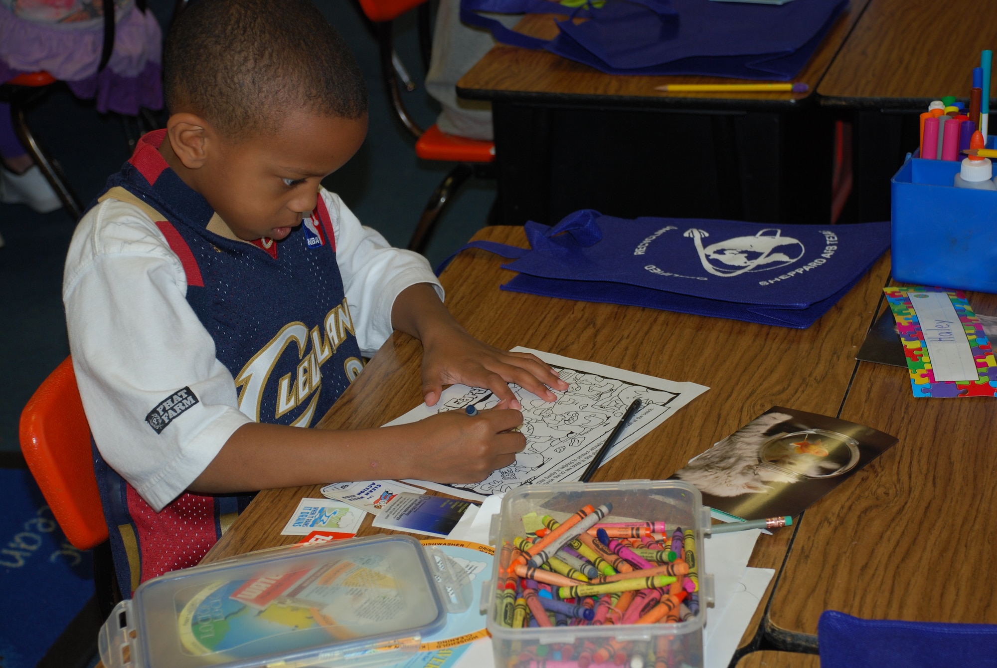 A Sheppard Elementary school second-grade class engaged in various fun activities during the class’ focus on Earth Day April 22, 2010.  Caleb Bunkley, second-grader, learned about recycling as he colored his “wild about earth” activity sheet.  (U.S. Air Force photo/Tech Sgt. Vernon Cunningham)