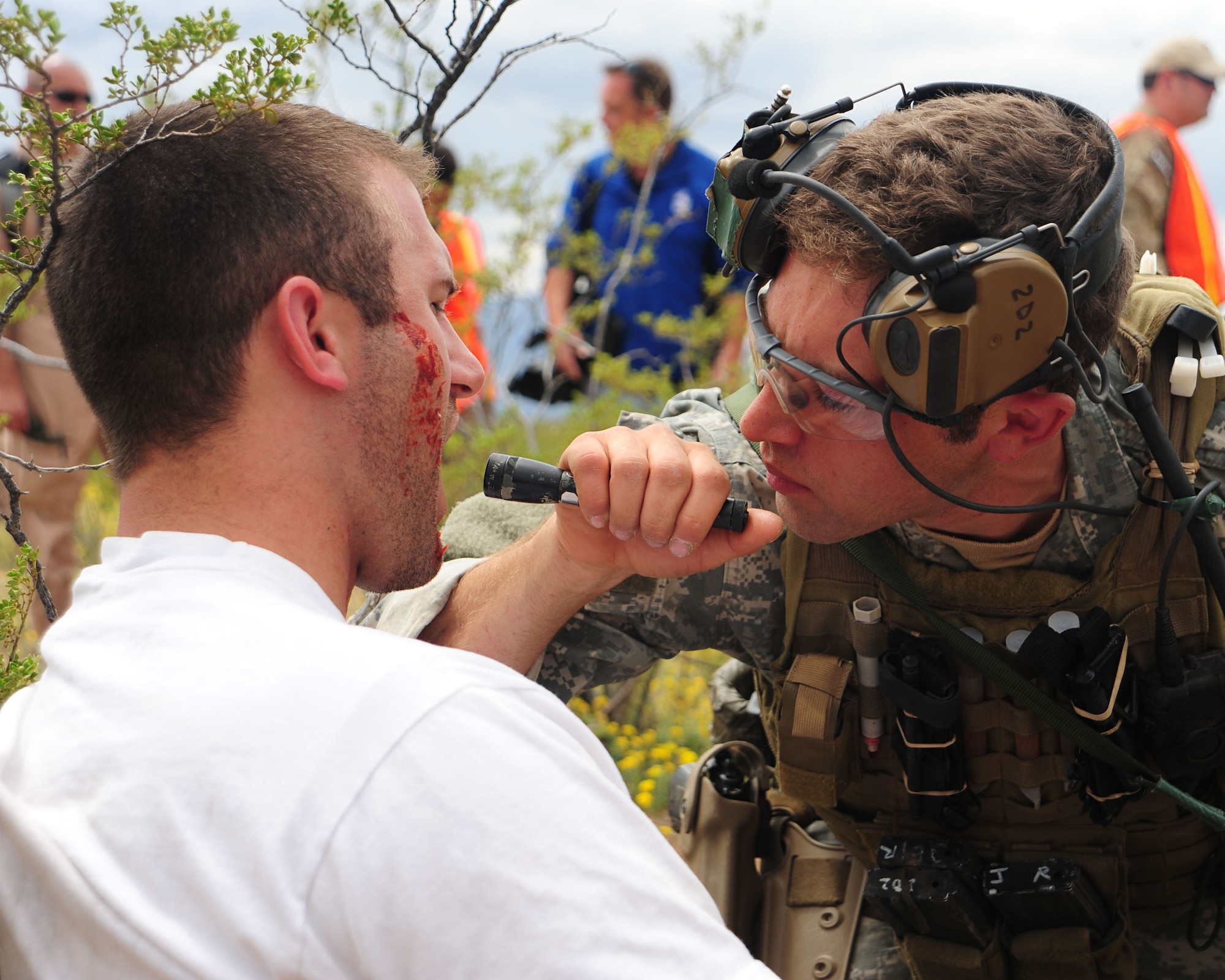 An Army Special Forces medic treats Darryl Leuseur, an Army Reserve Officer Training Corps MSII cadet from the University of Arizona, after sustaining injuries during a simulated earthquake scenario as part of combat search and rescue exercise Angel Thunder 2010 in Southern Arizona April 19. (U.S. Air Force photo/Airman Jerilyn Quintanilla)