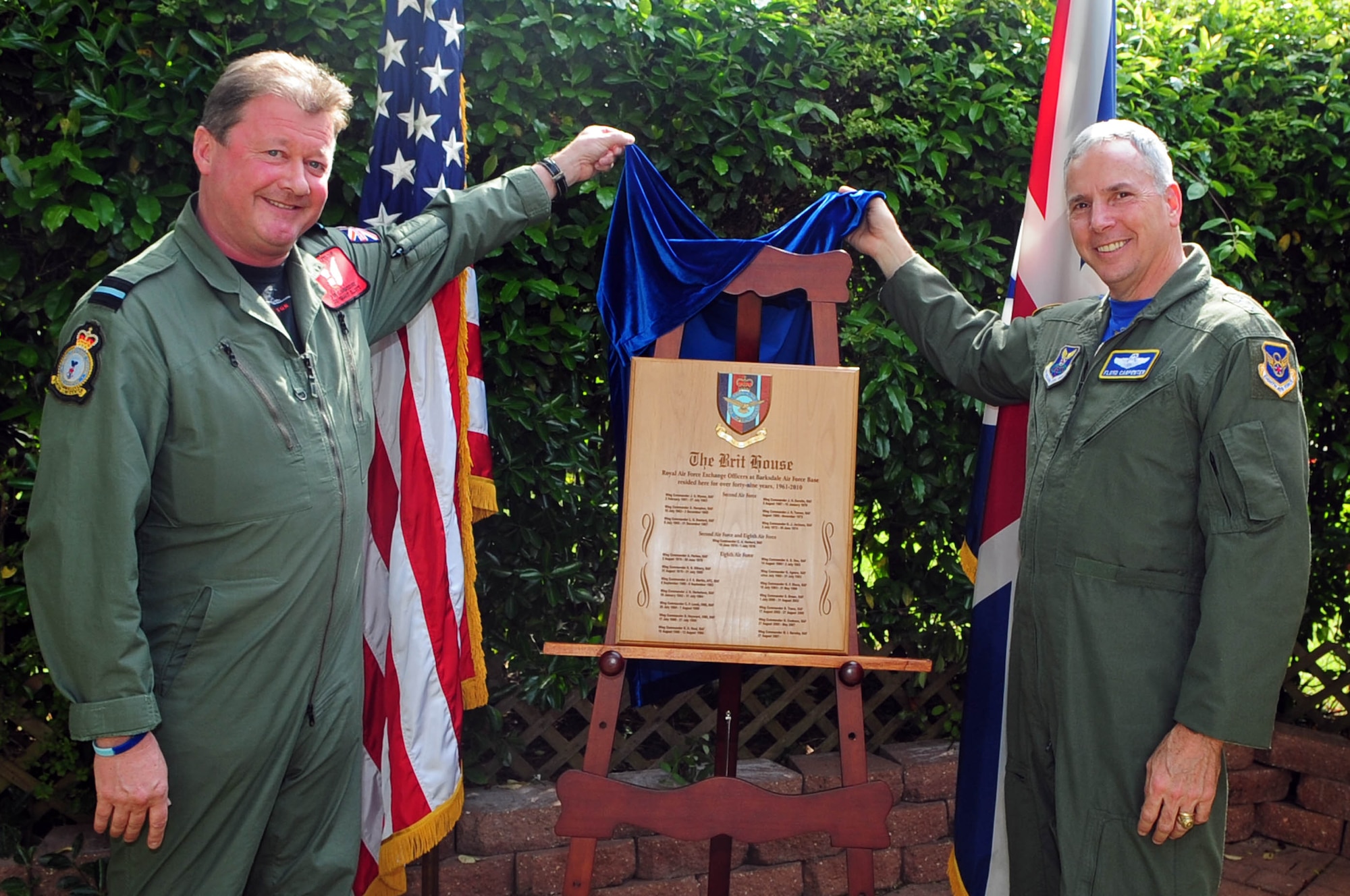 BARKSDALE AIR FORCE BASE, La. – Air Commodore Ian Ellott, Air Attache for the British Embassy in Washington D.C., and Maj. Gen. Floyd Carpenter, Eighth Air Force commander, unveil a plaque outside 203 Daedalus Avenue April 16. After more than 40 years, the Royal Air Force Exchange Officer program is leaving Barksdale and taking with it the home’s RAF tenants. (U.S. Air Force photo by Senior Airman Joanna M. Kresge)