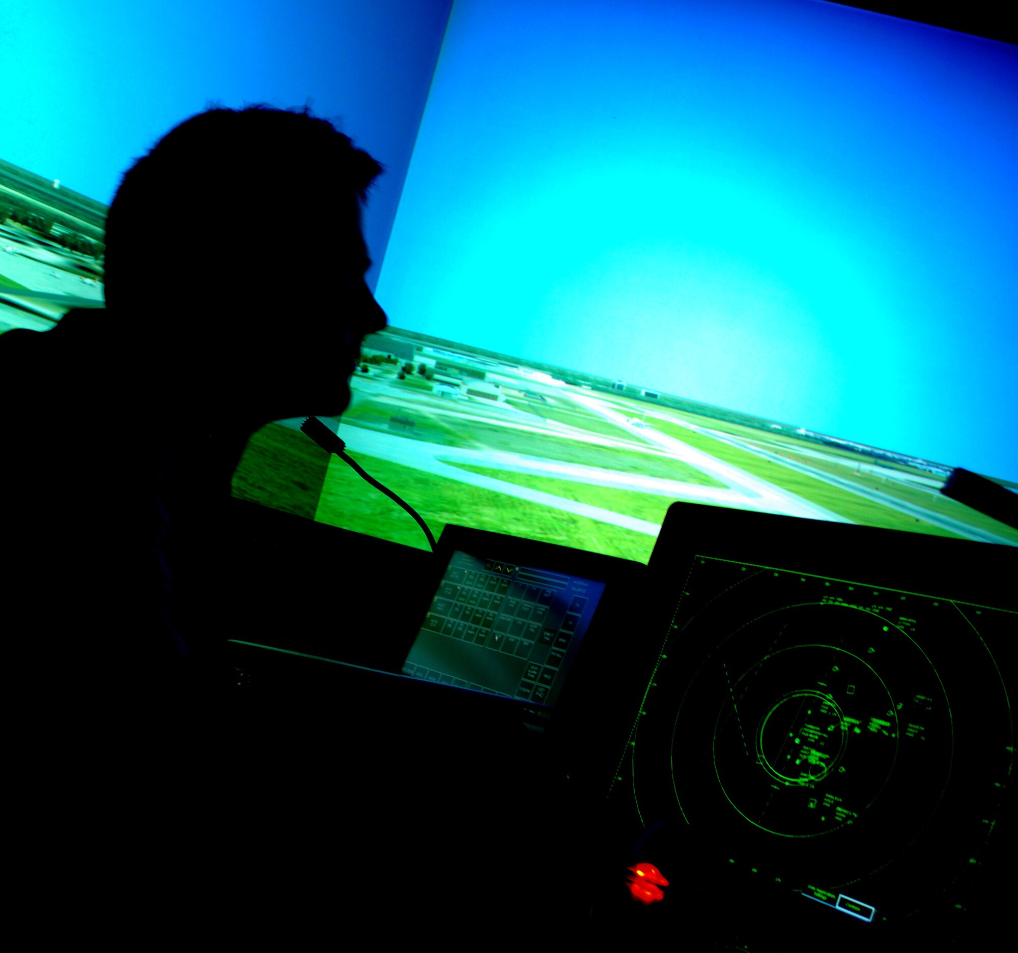 Austin Selzler, a South Dakota State University aviation student, tests his skills as an air traffic controller on the air traffic control tower simulator during a tour April 22, 2010, at McConnell Air Force Base, Kan.  In addition to the tower simulator, the 12 visiting SDSU students toured a KC-135 Stratotanker aircraft, the isochronal inspection dock and the KC-135 simulator. (U.S. Air Force photo/2nd Lt. Nicholas Mercurio)