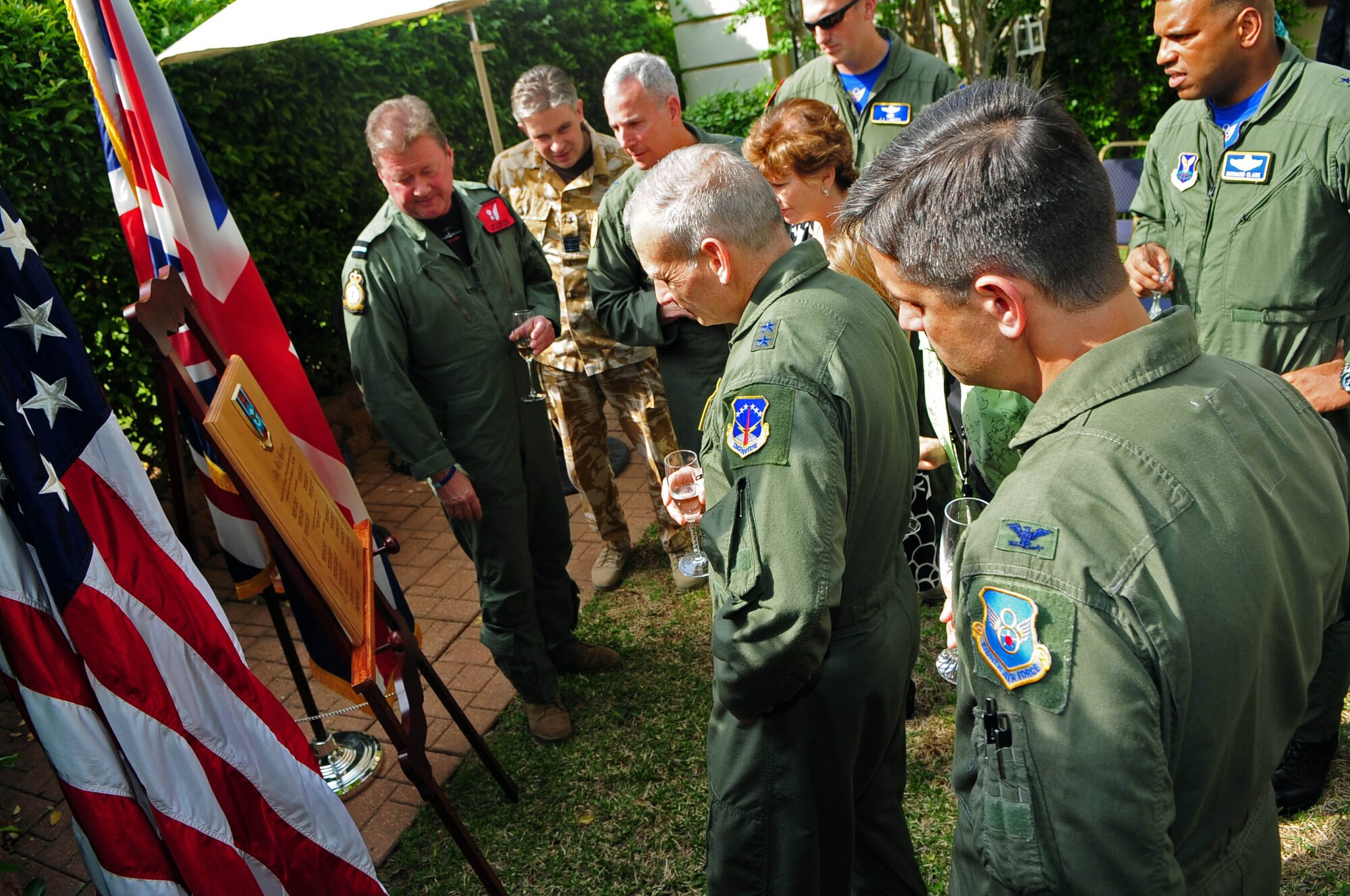 BARKSDALE AIR FORCE BASE, La. – Air Commodore Ian Elliott (left), Air Attaché for the British Embassy in Washington D.C. discusses the history of the home at 203 Daedalus Avenue with base leadership April 16 after unveiling a plaque declaring the home the ‘Brit House’. After more than 40 years, the Royal Air Force Exchange Officer program is leaving Barksdale and taking with it the home’s RAF tenants. (U.S. Air Force photo by Senior Airman Joanna M. Kresge)