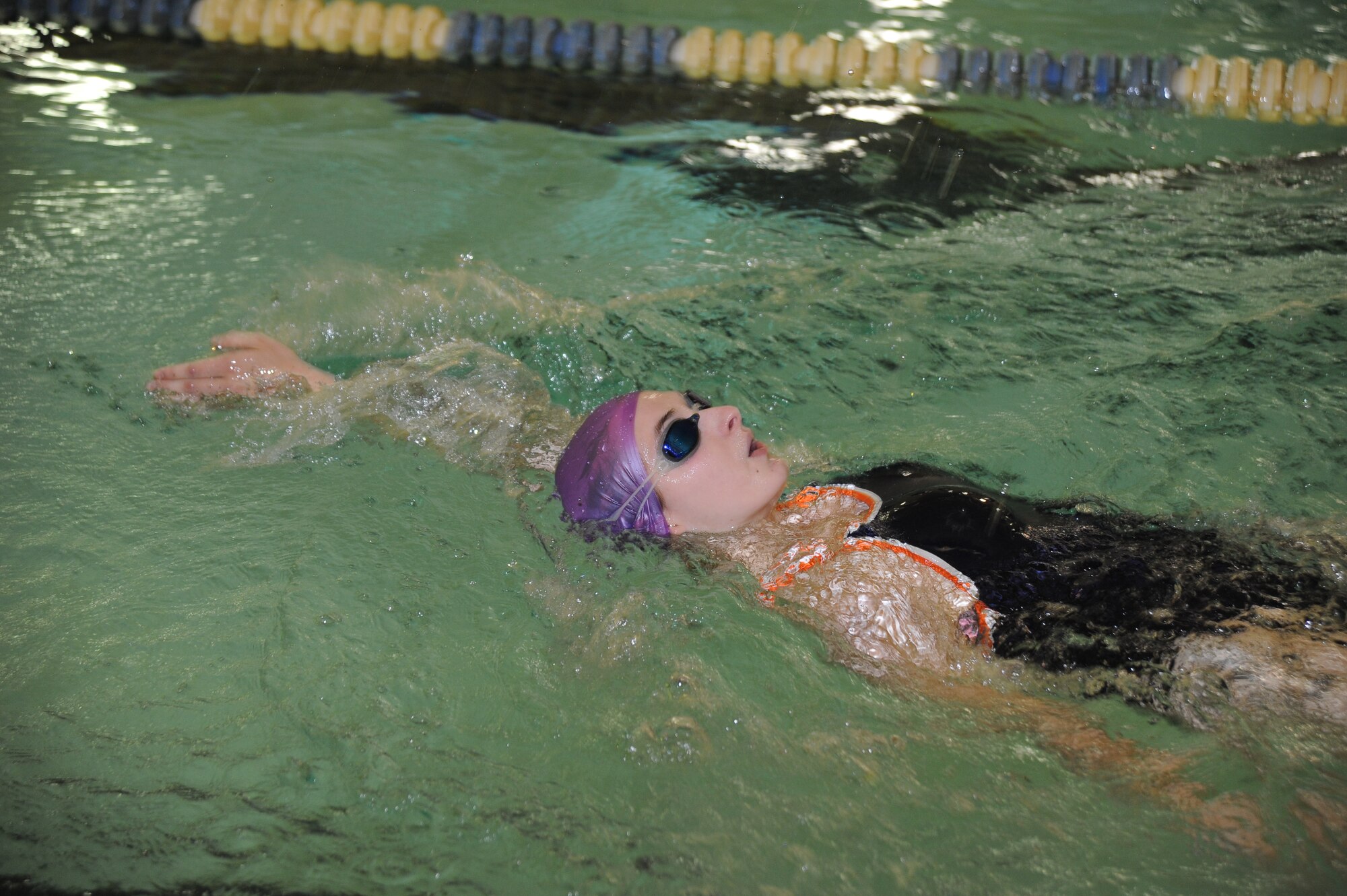 Airman 1st Class Rachael Smith, 22nd Aircraft Maintenance Unit analyst, swims a quarter mile for the 22nd Maintenance Operations Squadron triathlon team during Warrior Day, April 22, 2010, McConnell Air Force Base, Kan. Team McConnell Airmen demonstrated their “Fit-to-Fight” capabilities while competing in physical events and building unit esprit de corps. More than 400 Team McConnell Airmen from different units around the base competed in Warrior Day. (U.S. Air Force photo/Tech. Sgt. Chyrece Campbell)