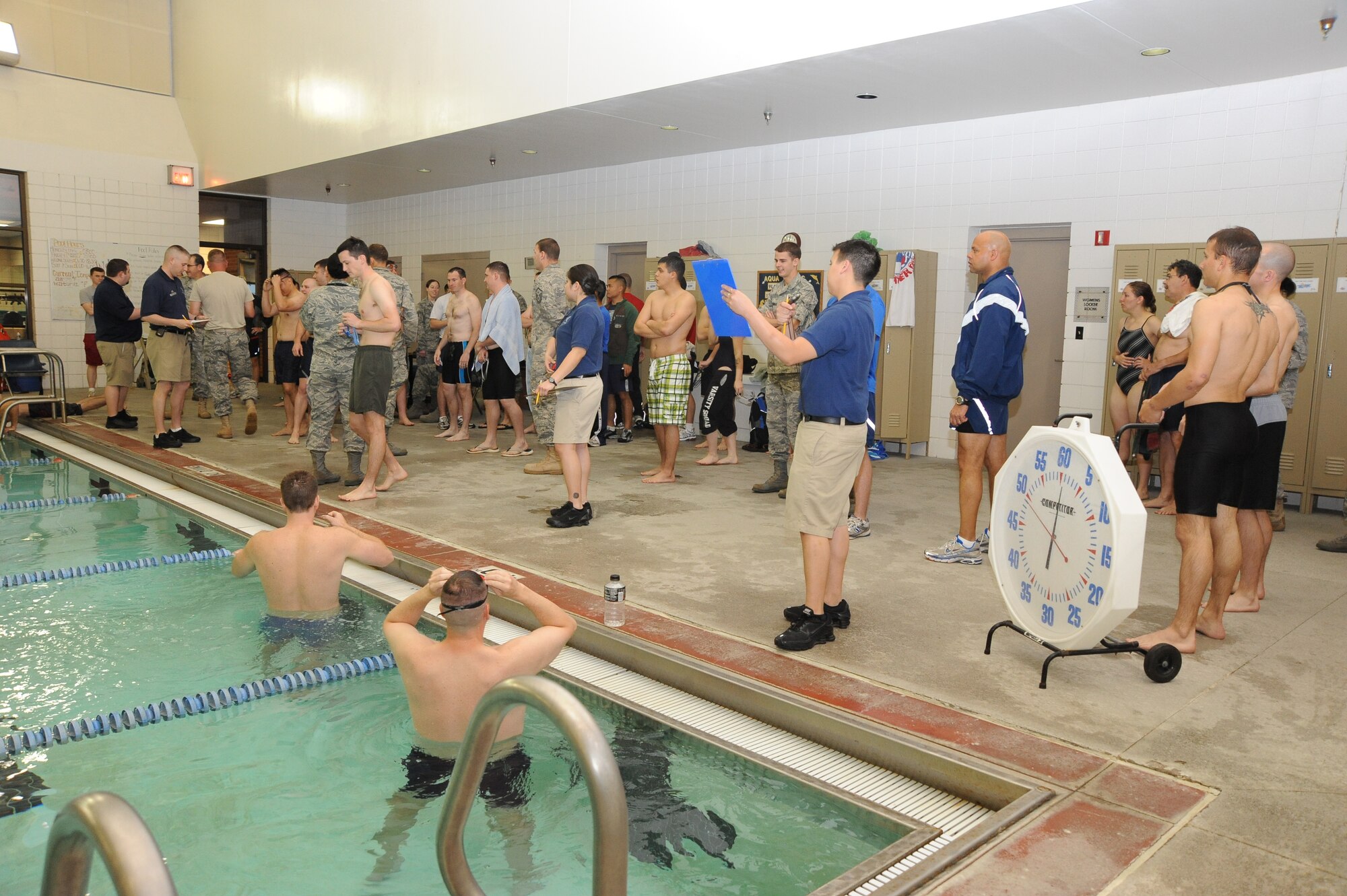 Team McConnell Airmen prepare to swim event as part of the indoor triathlon, April 22, 2010, McConnell Air Force Base, Kan. Units from around the base participated in 3-on-3 basketball tournament, dodge ball tournament, aerobics and other sports events during Warrior Day. Warrior Day is designed to promote physical fitness and build unit esprit de corps. McConnell’s Fitness Center hosted Warrior Day. (U.S. Air Force photo/Tech. Sgt. Chyrece Campbell) 