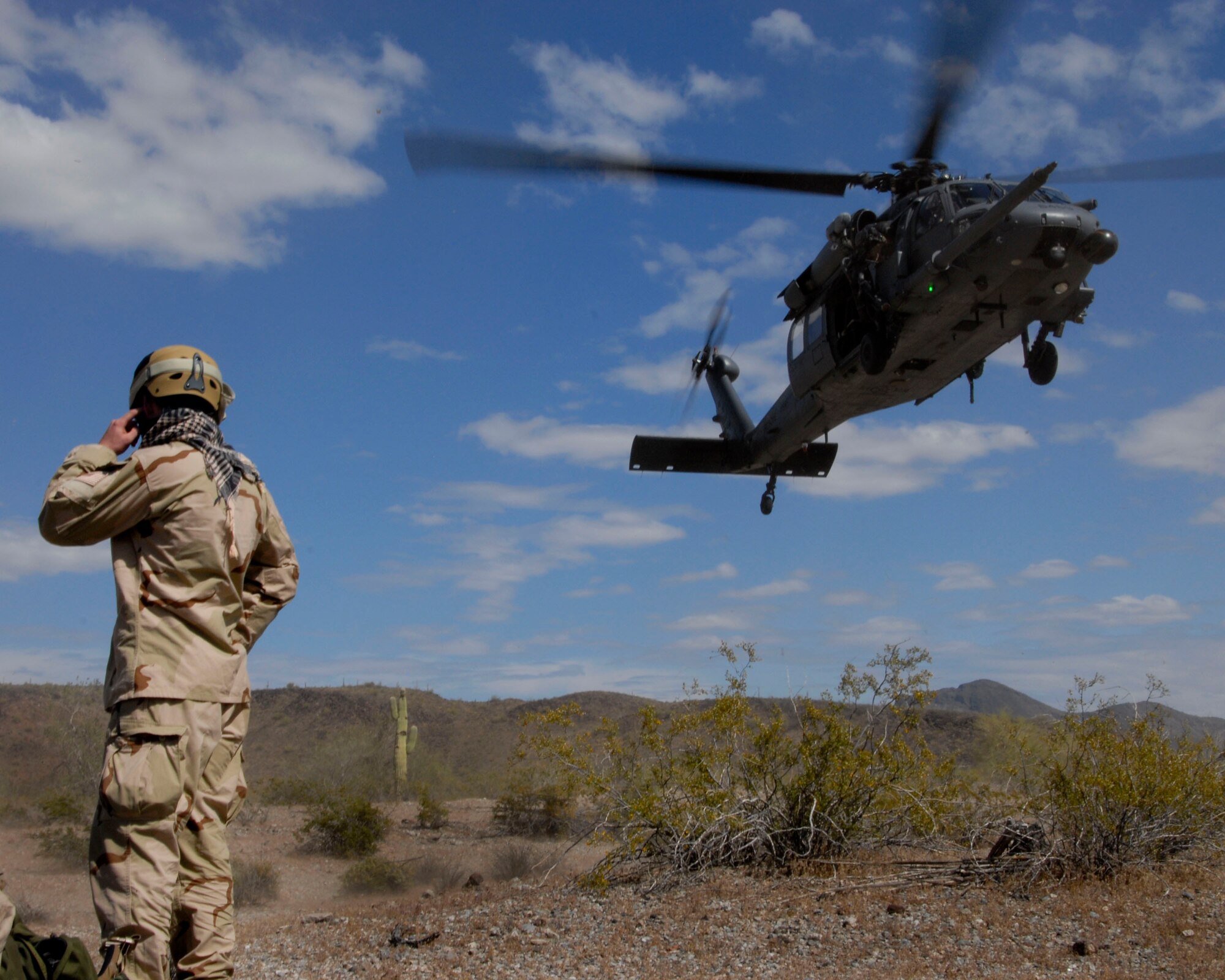 A U.S. Air Force HH-60G Pave Hawk rescue helicopter with the Alaska Air National Guard lands at the Barry M. Goldwater Range in the Sonoran Desert outside Davis-Monthan Air Force Base, Tucson, Ariz., April 19, 2010 during an Angel Thunder combat search and rescue exercise scenario. (U.S. Air National Guard photo/Airman 1st Class Jessica Green)