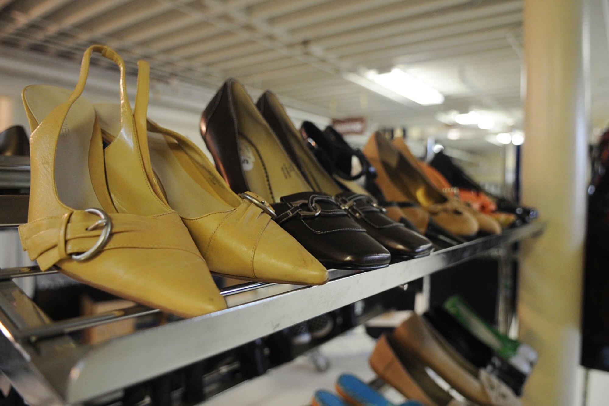 LANGLEY AIR FORCE BASE, Va. -- Shoes, among a variety of other items, wait to be picked up by Airmen in need of a little style at the Airman's attic here April 22. Donations are accepted during operation hours, and any time, seven days a week at the drop-off area. (U.S. Air Force photo/Staff Sgt. Ashley Hawkins) 
