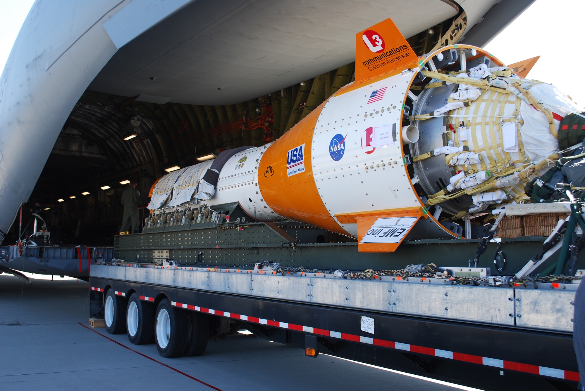 A jumbo drop test vehicle is loaded onto a C-17A T-1 April 14, 2010, at Edwards Air Force Base, Calif. (NASA photo)
