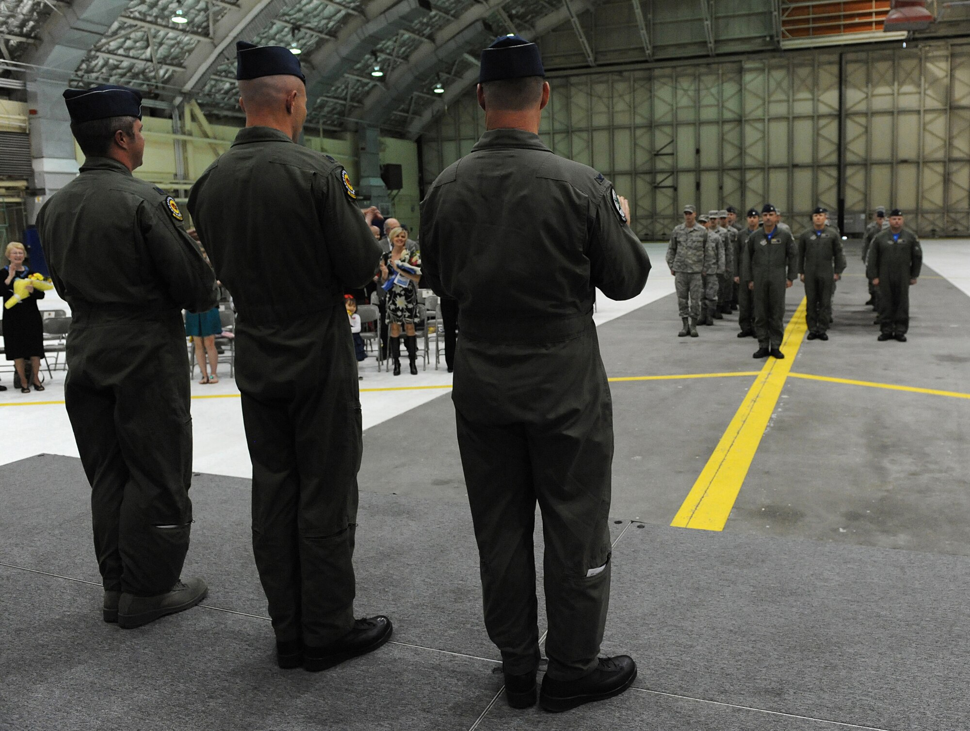 ELMENDORF AIR FORCE BASE, Alaska -- The offical party leads the group in singing the Air Force song at the end of the 19th Fighter Squadron final change of command ceremony. Lt. Col. Greg Miller assumed command during the ceremony. This was the final change of command before the 19th FS is deactivated in September. (Air Force photo by Senior Airman Cynthia Spalding)