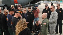 Lt. Col. David Condit (center) discusses wildland aerial firefighting scenarios April 22 with members of the Colorado Springs Fire Department's wildland firefighting team during the 302nd Airlift Wing's annual Modular Airborne Firefighting System wet fire test at Peterson Air Force Base, Colo. The wing test fired the new, "MAFFS II" system (background) in preparation of the U.S. Forest Service's MAFFS certification week April 25-May 1 in Greenville, S.C. Colonel Condit is the Air Force Reserve's MAFFS program coordinator and chief of safety for the 302nd AW. (U.S. Air Force photo/Staff Sgt. Stephen J. Collier)