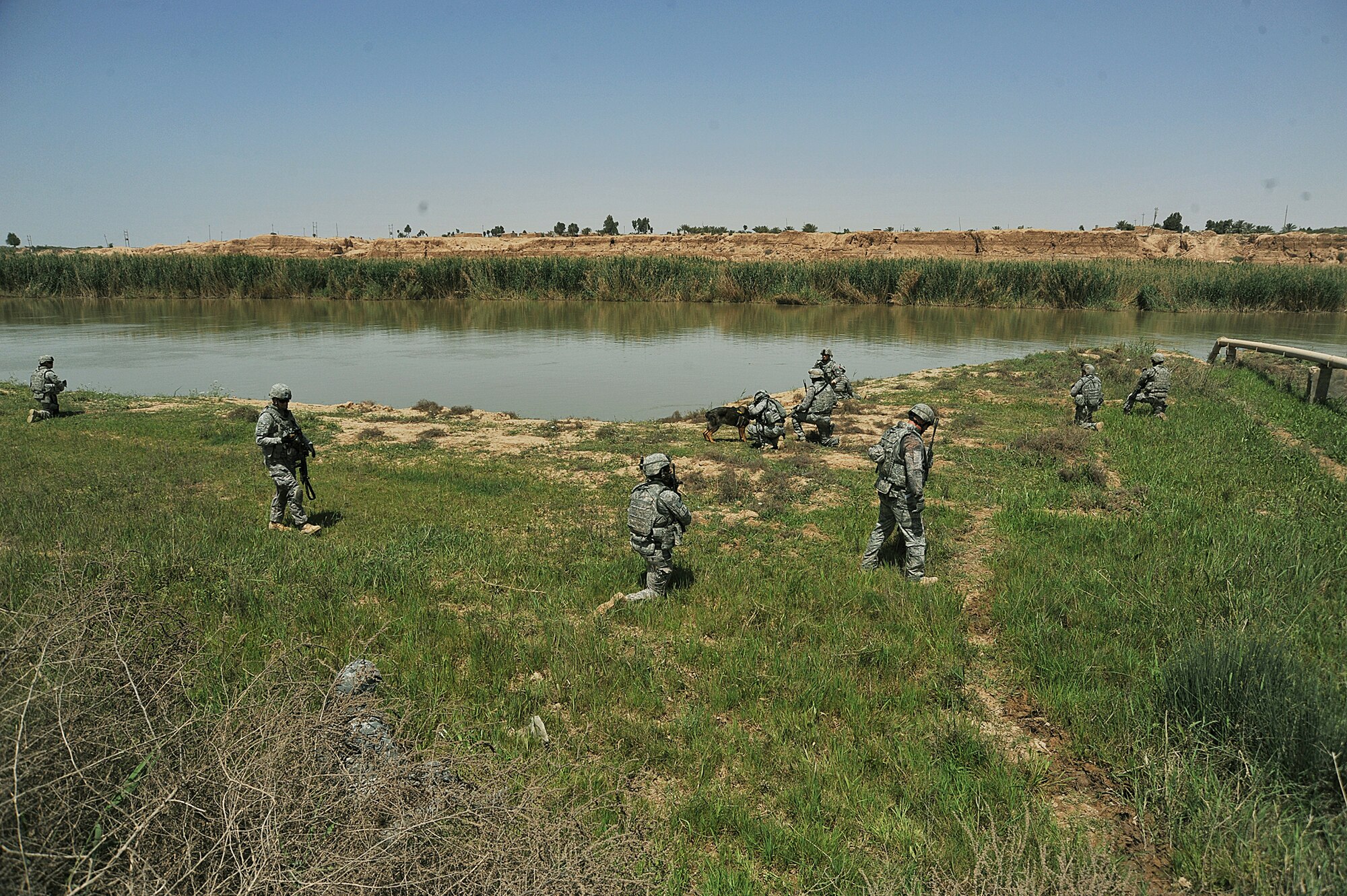 Air Force and Army members take a break along the Tigris river while conducting a dismounted patrol April 14, 2010, on the outskirts of Joint Base Balad, Iraq. (U.S. Air Force photo/Staff Sgt. Quinton Russ) 
