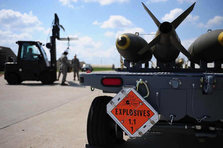 ELLSWORTH AIR FORCE BASE, S.D.- Munitions conventional maintenance crew members move a Mark 84 bomb, April 21. Mark 84’s are listed as 1.1 explosives meaning they have a mass explosion hazard. (U.S. Air Force photo/Airman 1st Class Corey Hook)