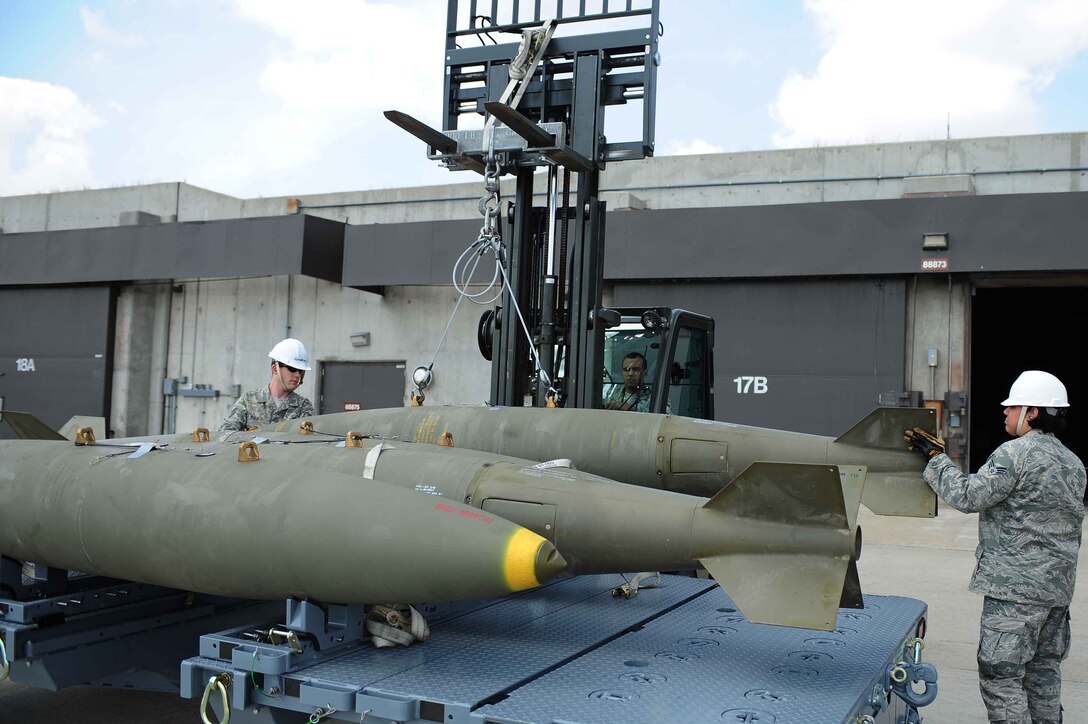 ELLSWORTH AIR FORCE BASE, S.D.- Munitions crew members move a Mark 84 bomb, April 21. A Mark 84 has a nominal weight of 2,000 pounds. (U.S. Air Force photo/Airman 1st Class Corey Hook)