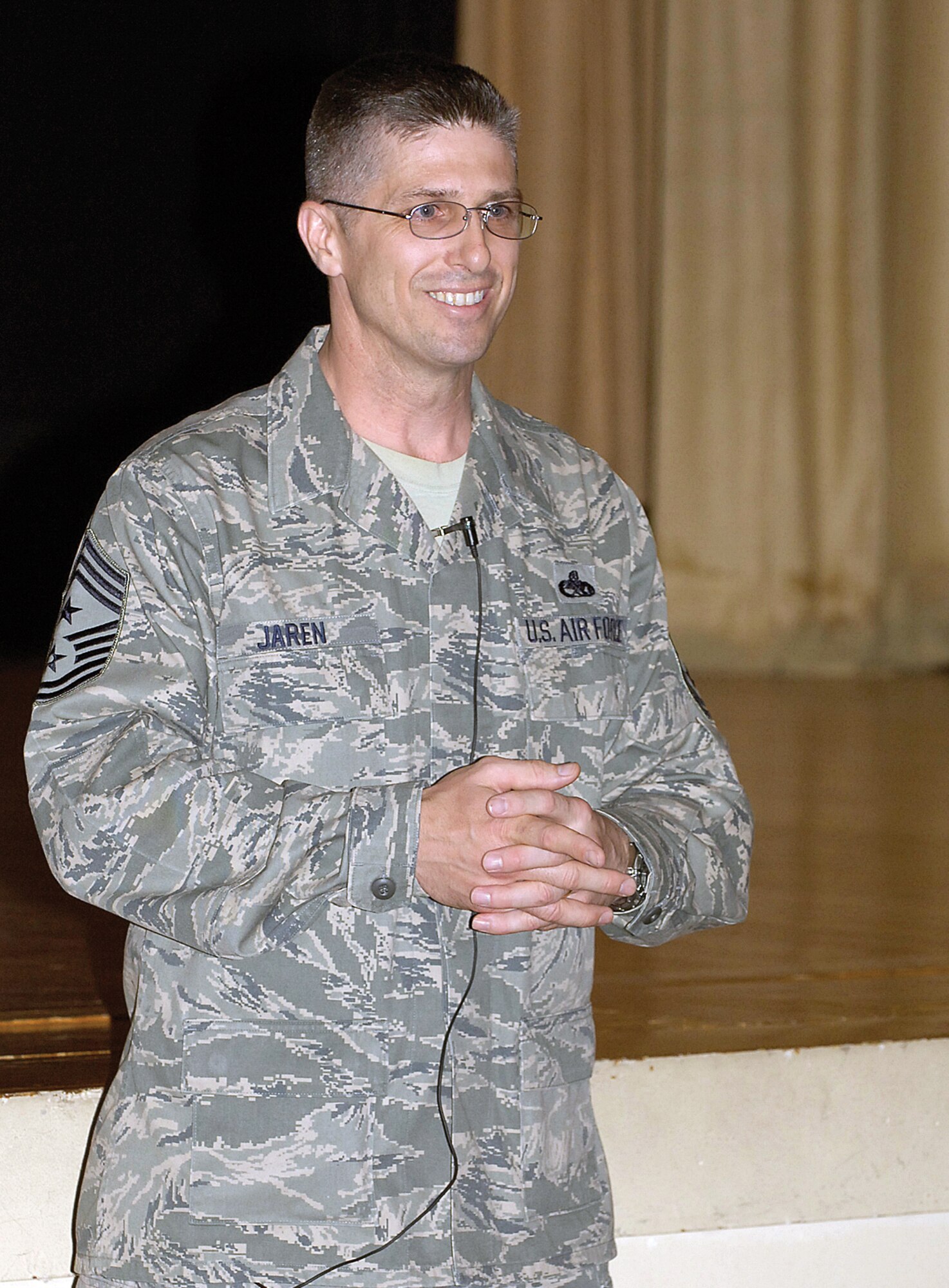 AFMC Command Chief Master Sgt. Eric Jaren held an enlisted call at the base theater during a visit to Tinker April 15. Chief Jaren spoke to Airmen about a variety of topics including the command's priorities, career opportunities and suicide prevention. (Air Force photo by Margo Wright)