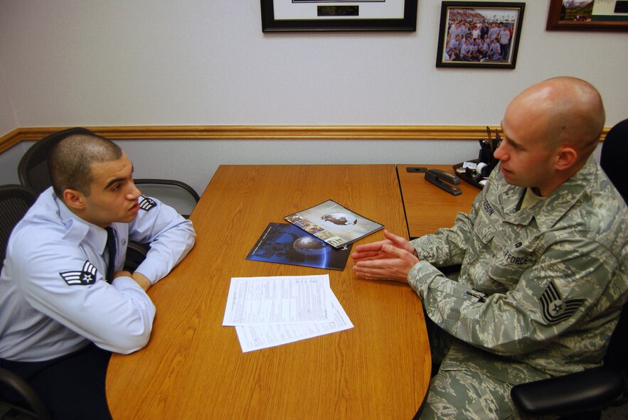 Senior Airman Ramon Espinal, 341st Medical Group Public Heath technician, gets more information about the Palace Chase program from Tech. Sgt. Derek Hudson, 341st Force Support Squadron in-service recruiter. The palace chase program allows active-duty officers and Airmen to voluntarily transfer from active military service to the Reserve or Air National Guard. (U.S. Air Force photo/Airman 1st Class Kristina Overton)