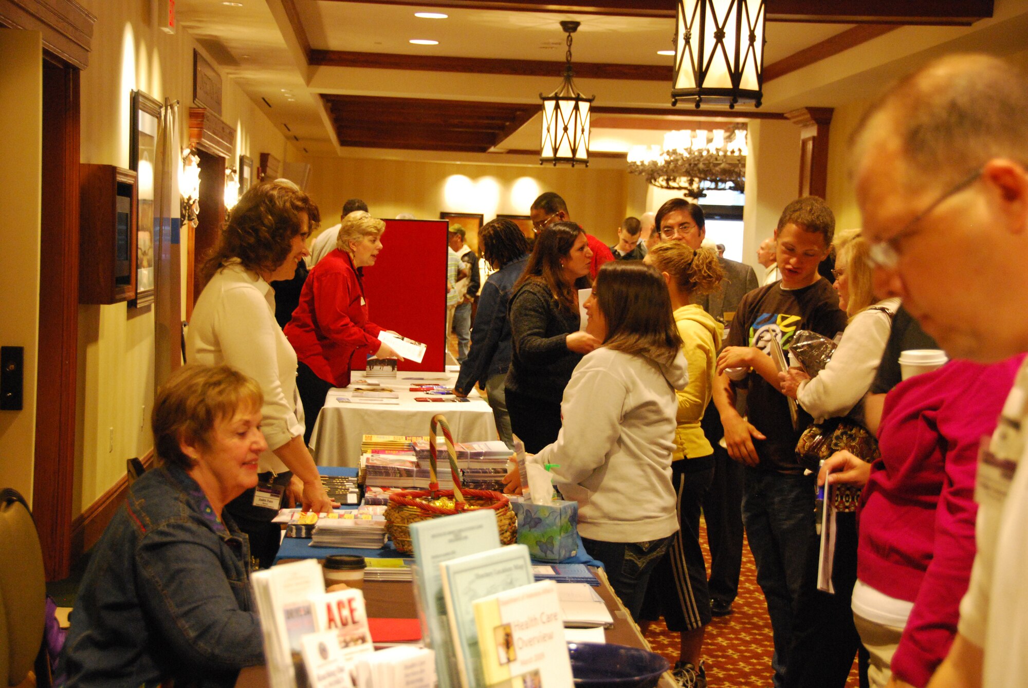 JOINT BASE MCGUIRE-DIX-LAKEHURST, N.J. - Participants of the Yellow Ribbon Reintegration event held April 16-18 at Hershey Lodge, Hershey, Pa., register and peruse the exhibition tables. The event provides deployed Airmen resources to help ease their transition home post deployment. (U.S. Air Force photo/Master Sgt. Donna T. Jeffries)