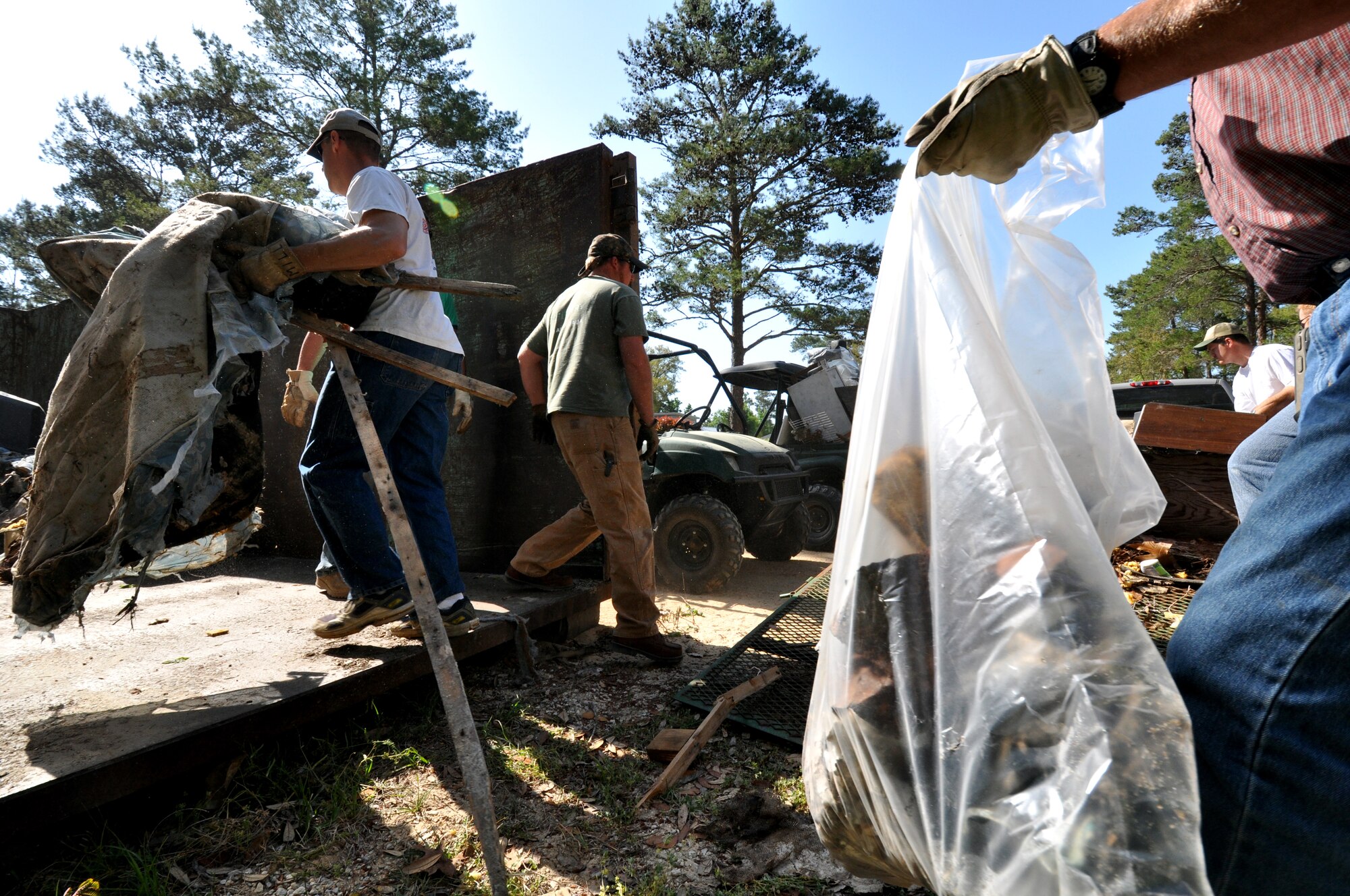 Volunteers drag, bag and carry garbage found throughout the Eglin Air Force Base range April 21.   30 volunteers picked up 5,400 pounds of garbage this year. The range clean-up is an annual event that coincides with Earth Day.  (U.S. Air Force photo/Airman 1st Class Anthony Jennings.)
