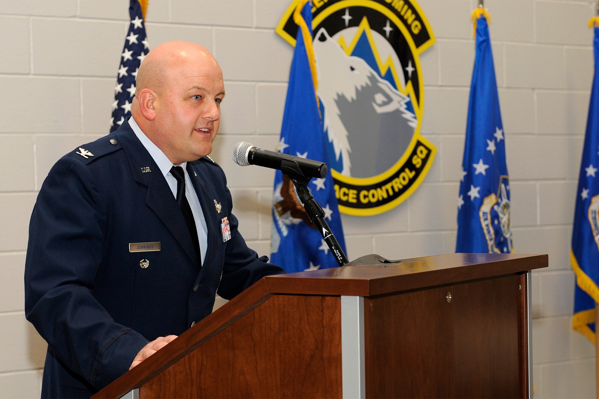 Col. Jim Jennings, 21st Space Wing vice commander, dedicates the new 76th Space Control Squadron building to its members April 5. Colonel Jennings is a former 76th SPCS commander, and was there Feb. 9, 2007, for the groundbreaking ceremony of the state-of-the-art 34,784 square-foot building. The $13.4 million facility is built on 4.1 acres, on Stewart Avenue, past the base exchange and commissary. (U.S. Air Force photo/Craig Denton)
