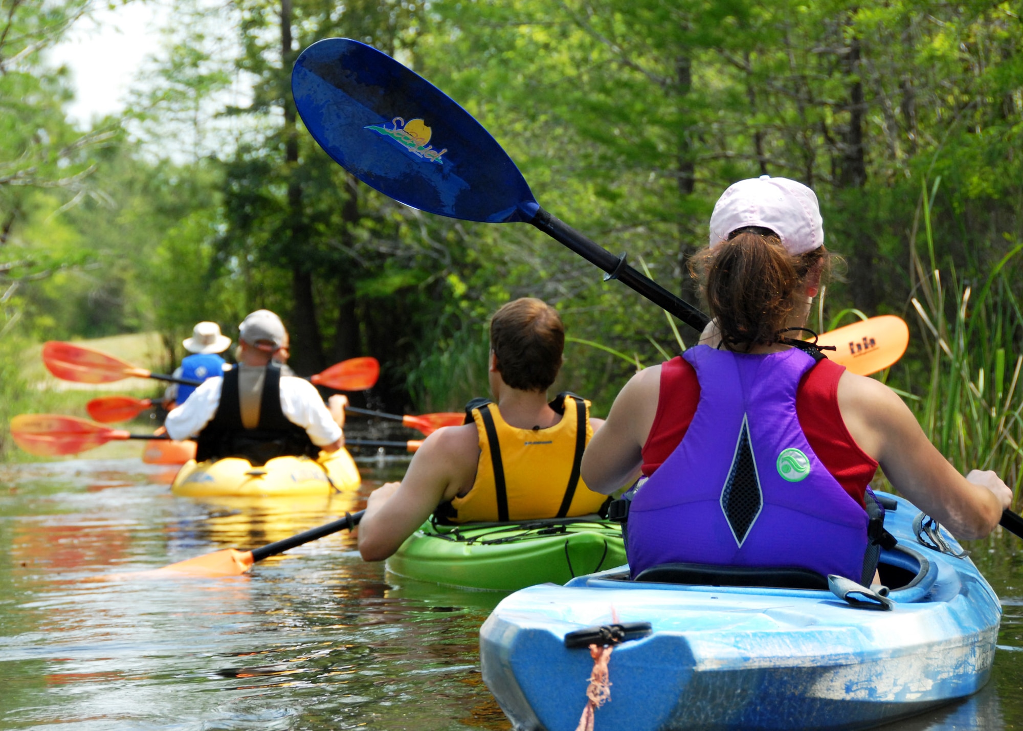 Kayakers drift toward the end of the first-ever kayak tour through the Eglin Air Force Base range April 19. The five and a half mile kayak tour took 10 people down Boiling Creek and the Yellow River deep within the Eglin range.  The scenic tour showed off Eglin’s unique wild and plant life.  It kicked off Eglin’s week-long Earth Day celebration.   (U.S. Air Force photo/Samuel King Jr.)