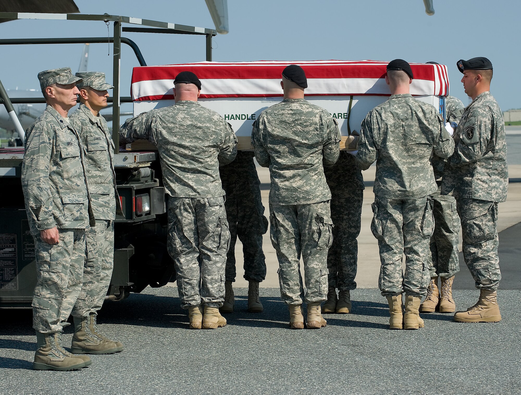 A U.S. Army carry team transfers the remains of Army Pfc. Jonathon D. Hall of Chattanooga, Tenn., at Dover Air Force Base, Del., on April 15, 2010. Hall died April 8, at the Landstuhl Regional Medical Center, Landstuhl, Germany, of wounds suffered when enemy forces attacked his vehicle with an improvised explosive device at Contingency Outpost Khayr-Kot-Castle, Afghanistan. He was assigned to the 3rd Battalion, 187th Infantry Regiment, 3rd Brigade Combat Team, 101st Airborne Division (Air Assault), Fort Campbell, Ky. (U.S. Air Force photo/Brianne Zimny)