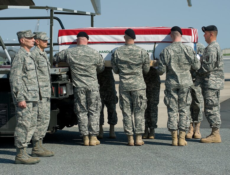 A U.S. Army carry team transfers the remains of Army Pfc. Jonathon D. Hall of Chattanooga, Tenn., at Dover Air Force Base, Del., on April 15, 2010. Hall died April 8, at the Landstuhl Regional Medical Center, Landstuhl, Germany, of wounds suffered when enemy forces attacked his vehicle with an improvised explosive device at Contingency Outpost Khayr-Kot-Castle, Afghanistan. He was assigned to the 3rd Battalion, 187th Infantry Regiment, 3rd Brigade Combat Team, 101st Airborne Division (Air Assault), Fort Campbell, Ky. (U.S. Air Force photo/Brianne Zimny)