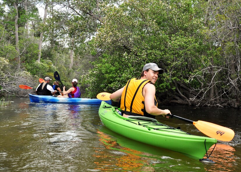 Taylor Tidwell, 96th Civil Engineer Group, takes one more look back April 19 during the first-ever Kayak tour through Eglin’s range.  The five and a half mile kayak tour took 10 people down Boiling Creek and the Yellow River deep within the Eglin range.  The scenic tour showed off Eglin’s unique wild and plant life.  It kicked off Eglin’s week-long Earth Day celebration.   (U.S. Air Force photo/Samuel King Jr.)