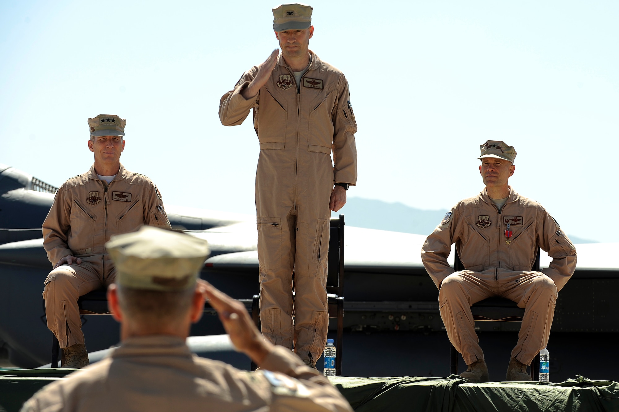 U.S. Air Force Col. Jack Briggs II, commander, 455th Air Expeditionary Wing, receives his first salute from the troops from Col. Joe Beissner, vice commander, 455th AEW, during a change of command at Bagram Airfield, Afghanistan, April 23, 2010. (U.S. Air Force photo by/ Tech. Sgt. Jeromy K. Cross/released)