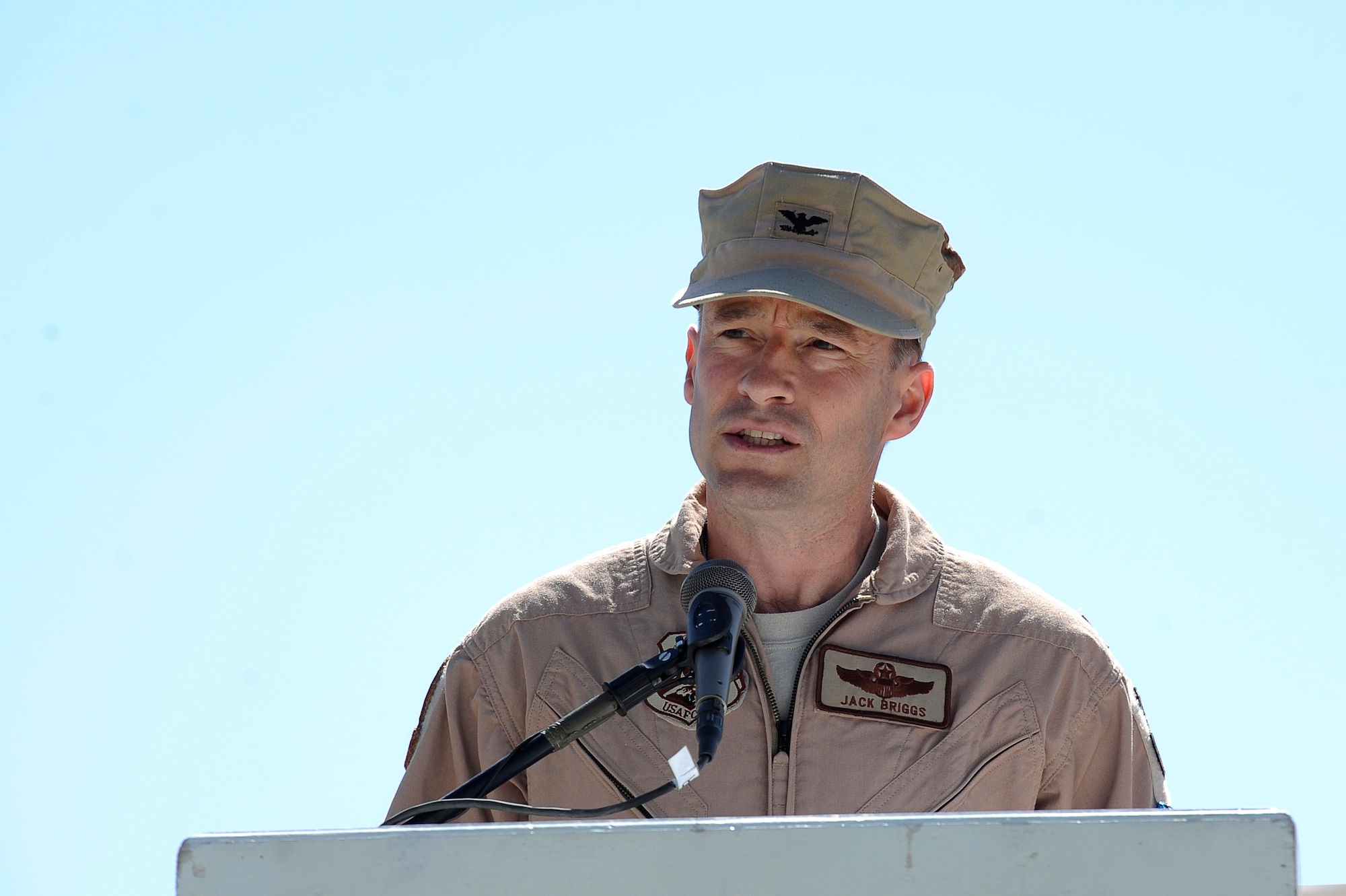 U.S. Air Force Col. Jack Briggs II, commander, 455th Air Expeditionary Wing, gives his assumption of command speech during the 455th Air Expeditionary Wing change of command ceremony at Bagram Airfield, Afghanistan, April 23, 2010. During the ceremony, Brig. Gen. Steven Kwast transferred command to Colonel Briggs. (U.S. Air Force photo by/ Tech. Sgt. Jeromy K. Cross/released)