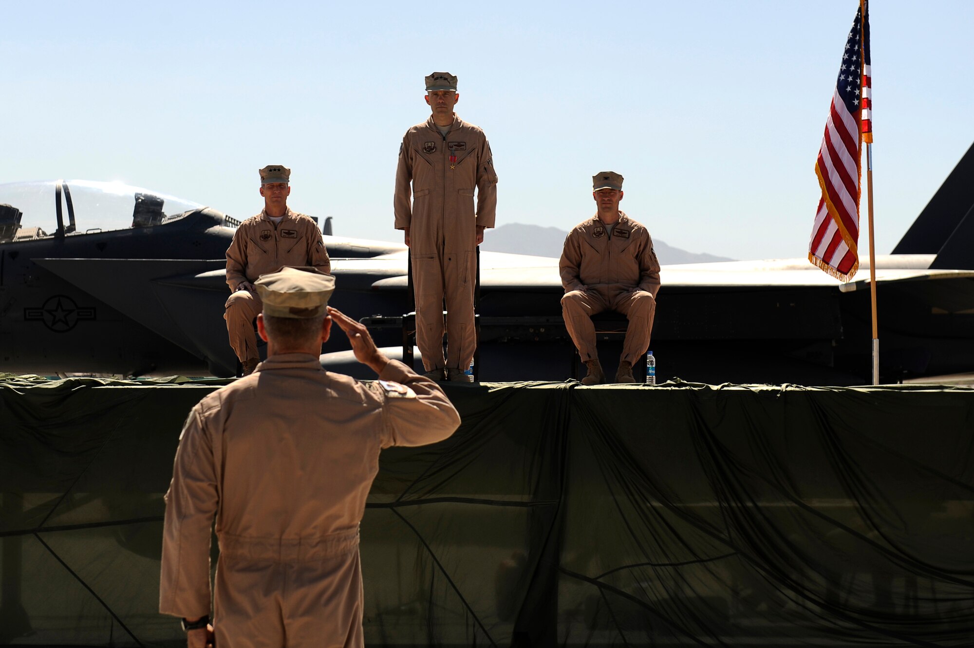 U.S. Air Force Brig. Gen. Steven Kwast receives his final salute from the troops from Col. Joe Beissner, vice commander, 455th Air Expeditionary Wing during a change of command at Bagram Airfield, Afghanistan, April 23, 2010. (U.S. Air Force photo by/ Tech. Sgt. Jeromy K. Cross/released)