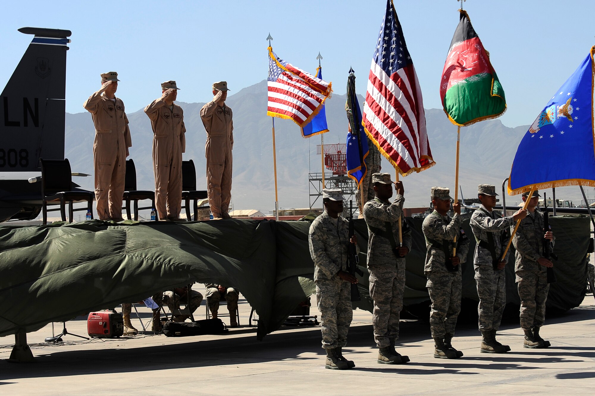 U.S. Air Force Lt. Gen. Mike Hostage III (left), U.S. Air Forces Central Command commander, presides over the 455th Air Expeditionary Wing change of command ceremony in which Brig. Gen. Steven Kwast transfers command to Col. Jack Briggs II at Bagram Airfield, Afghanistan, April 23, 2010. . (U.S. Air Force photo by/ Tech. Sgt. Jeromy K. Cross/released)