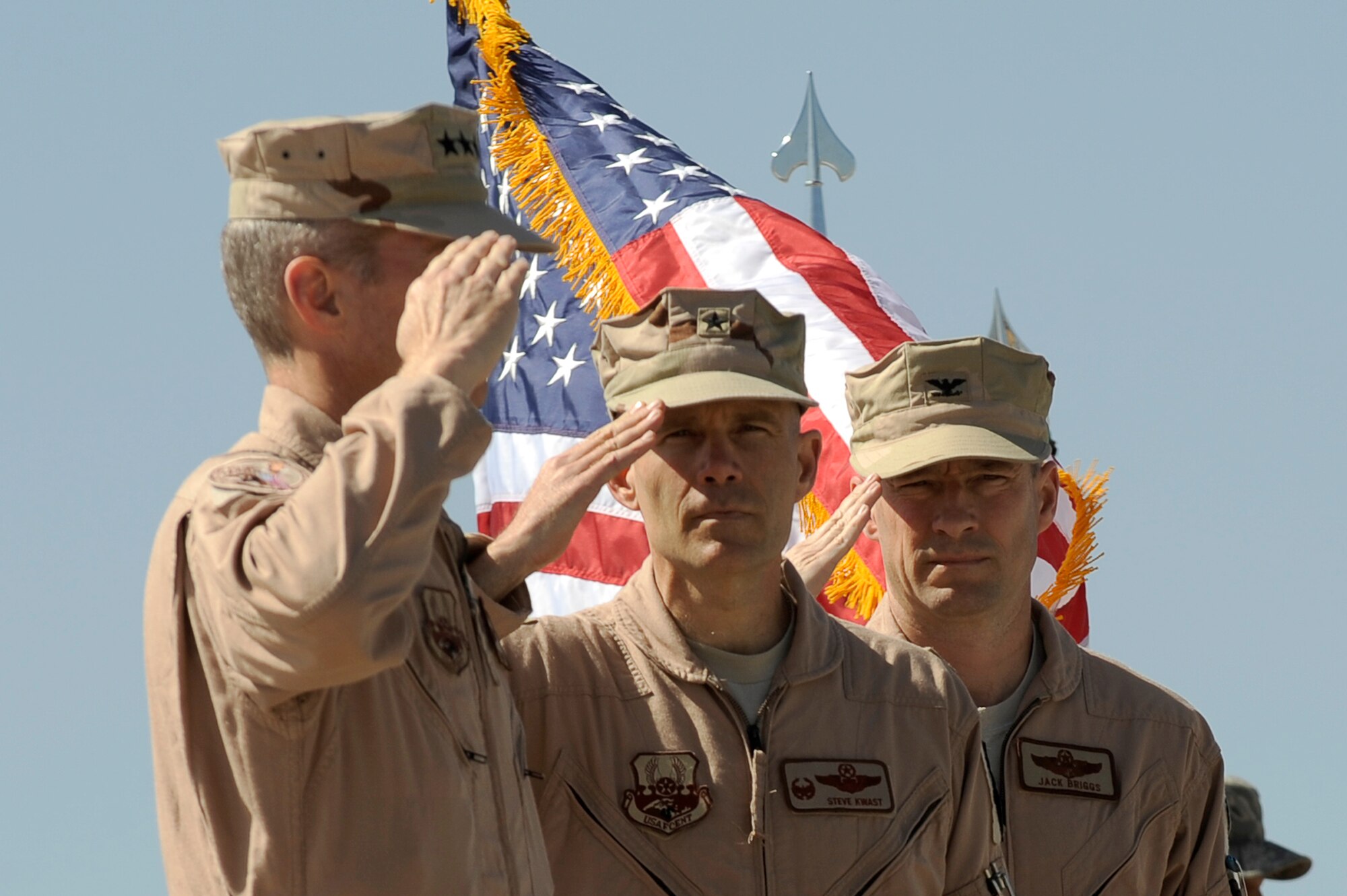 U.S. Air Force Brig. Gen. Steven Kwast and Col. Jack Briggs II salute Lt. Gen. Mike Hostage III, U.S. Air Forces Central Command commander, during the 455th Air Expeditionary Wing change of command ceremony at Bagram Airfield, Afghanistan, April 23, 2010. (U.S. Air Force photo by/ Tech. Sgt. Jeromy K. Cross/released)









