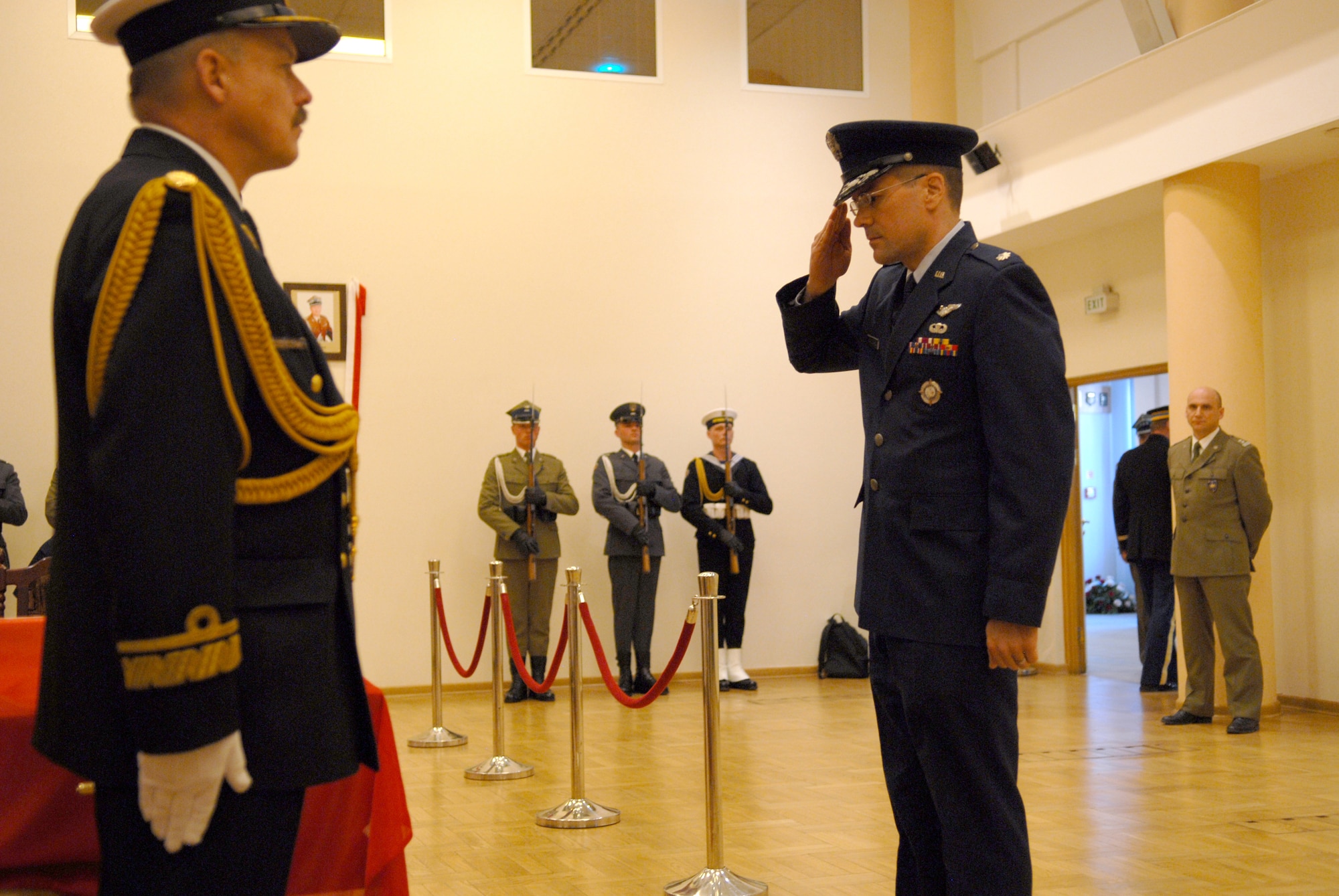 Air Force Lt. Col. Scott Wallace pays respects to Polish Gen. Franciszek
Gangor, Chief of the General Staff of the Polish Armed Forces, at
the Polish General Staff Headquarters in Warsaw, April 20. Colonel Wallace works in
the Office of Defense Cooperation in the U.S. Embassy in Warsaw. (U.S. Air Force photo/Capt. John Ross)