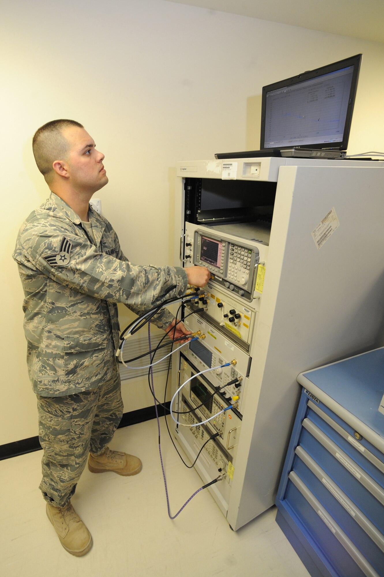 Senior Airman Kyle Martin, 379th Expeditionary Maintenance Squadron Precision Measurement Equipment Laboratory technician, calibrates phase noise on a signal generator at a non-disclosed Southwest Asia location, April 19, 2010. (U.S. Air Force photo by Tech. Sgt. Michelle Larche)