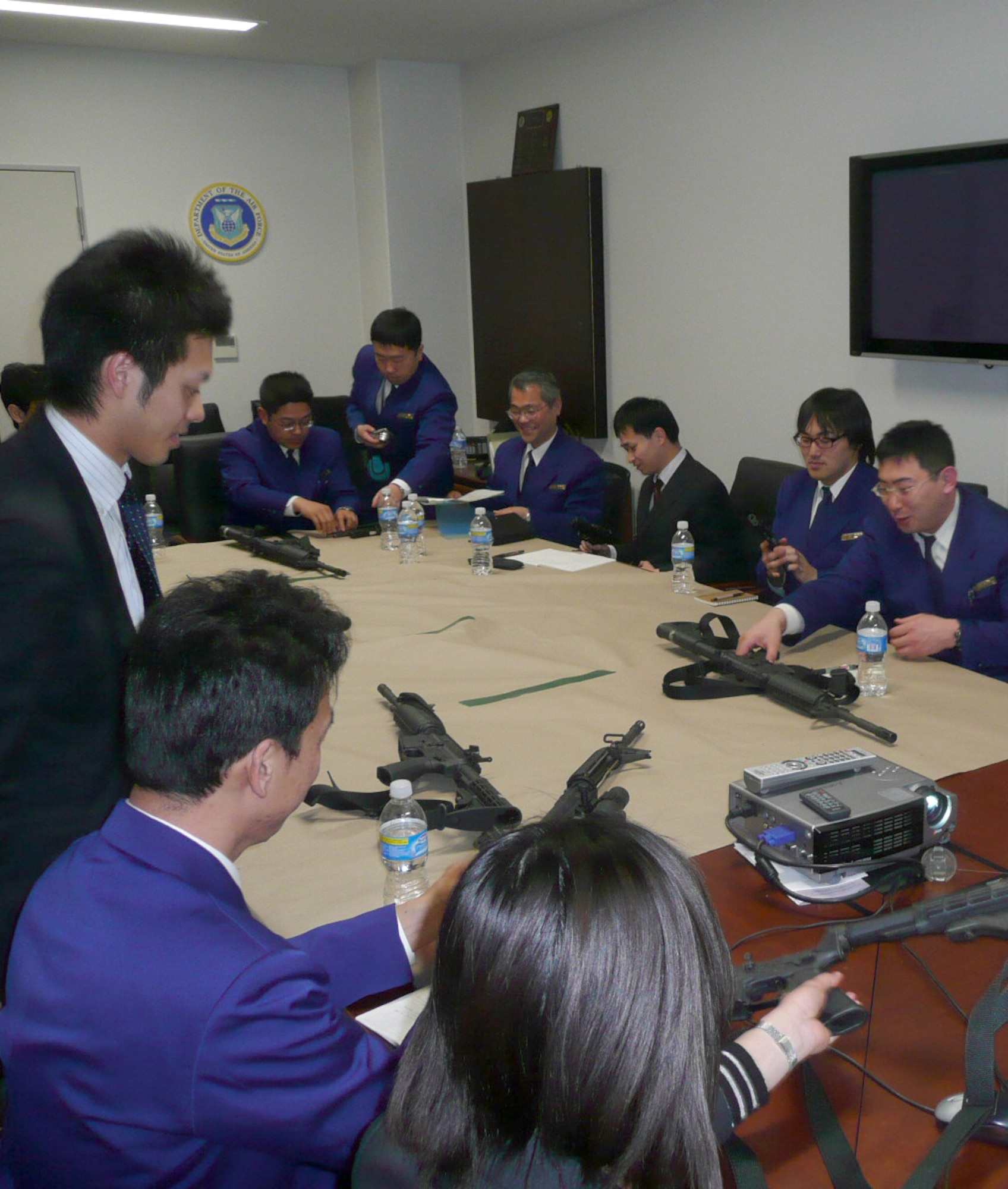 Agents from the Air Force Office of Special Investigations, Detachment 623 and Airmen from the 35th Civil Engineer Squadron Explosive Ordnance Unit teach Hakodate Japan customs inspectors about firearms and explosives at Misawa Air Base, Japan in 2009. This annual training allows the inspectors to detect threats that pass through Japan’s transit systems.  (courtesy photo) 